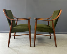 Load image into Gallery viewer, Pair of Danish lounge chairs in the style of Peter Hvidt, featuring sculptural walnut frames and green velvet upholstered seats and backs