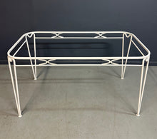 Load image into Gallery viewer, 1940s French mid-century modern outdoor dining set featuring six white wrought iron chairs with orange diamond-patterned cushions and a matching table with decorative curved frames