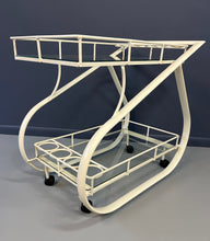 Load image into Gallery viewer, Vintage 1980s postmodern two-tier bar cart with curvy metal frame and glass shelves, attributed to Woodard