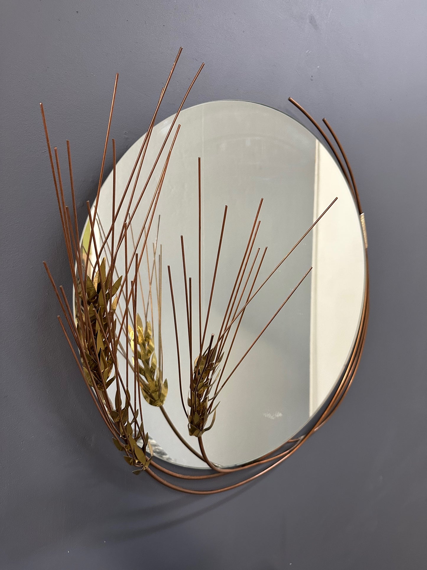 Vintage 1981 Curtis Jere round wall mirror with brass wheat stalk design, mid-century modern decor