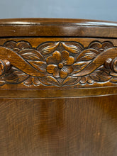 Load image into Gallery viewer, 1920s English Art Nouveau sideboard in oak with ornate floral and vine hand-carving, three-door storage, and bun feet