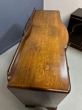Load image into Gallery viewer, 1920s English Art Nouveau sideboard in oak with ornate floral and vine hand-carving, three-door storage, and bun feet