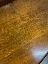 Load image into Gallery viewer, 1920s English Art Nouveau sideboard in oak with ornate floral and vine hand-carving, three-door storage, and bun feet