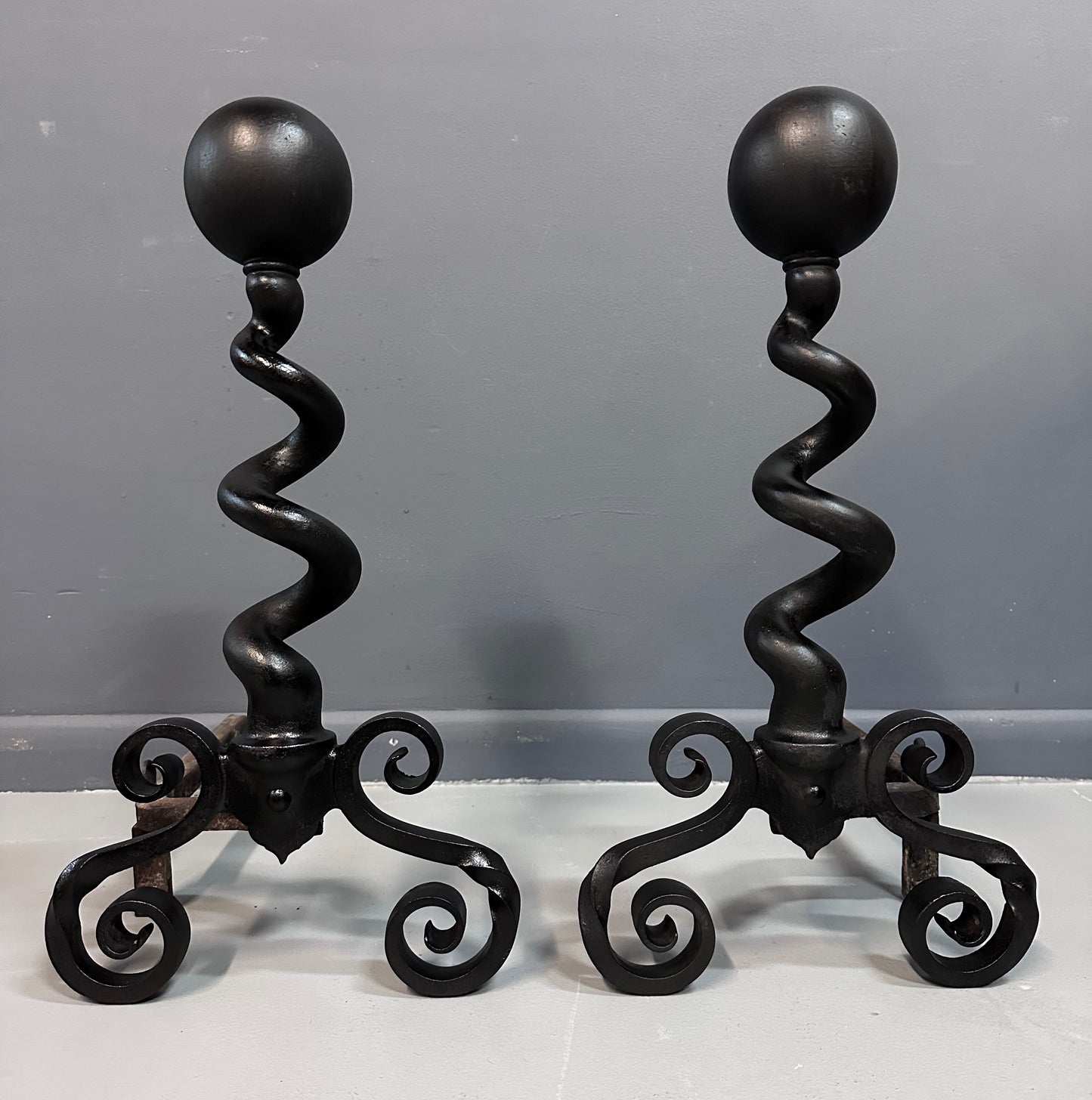 SOLD – Bradley & Hubbard Andirons Cast Iron Cannonball Tops Over Corkscrew Columns