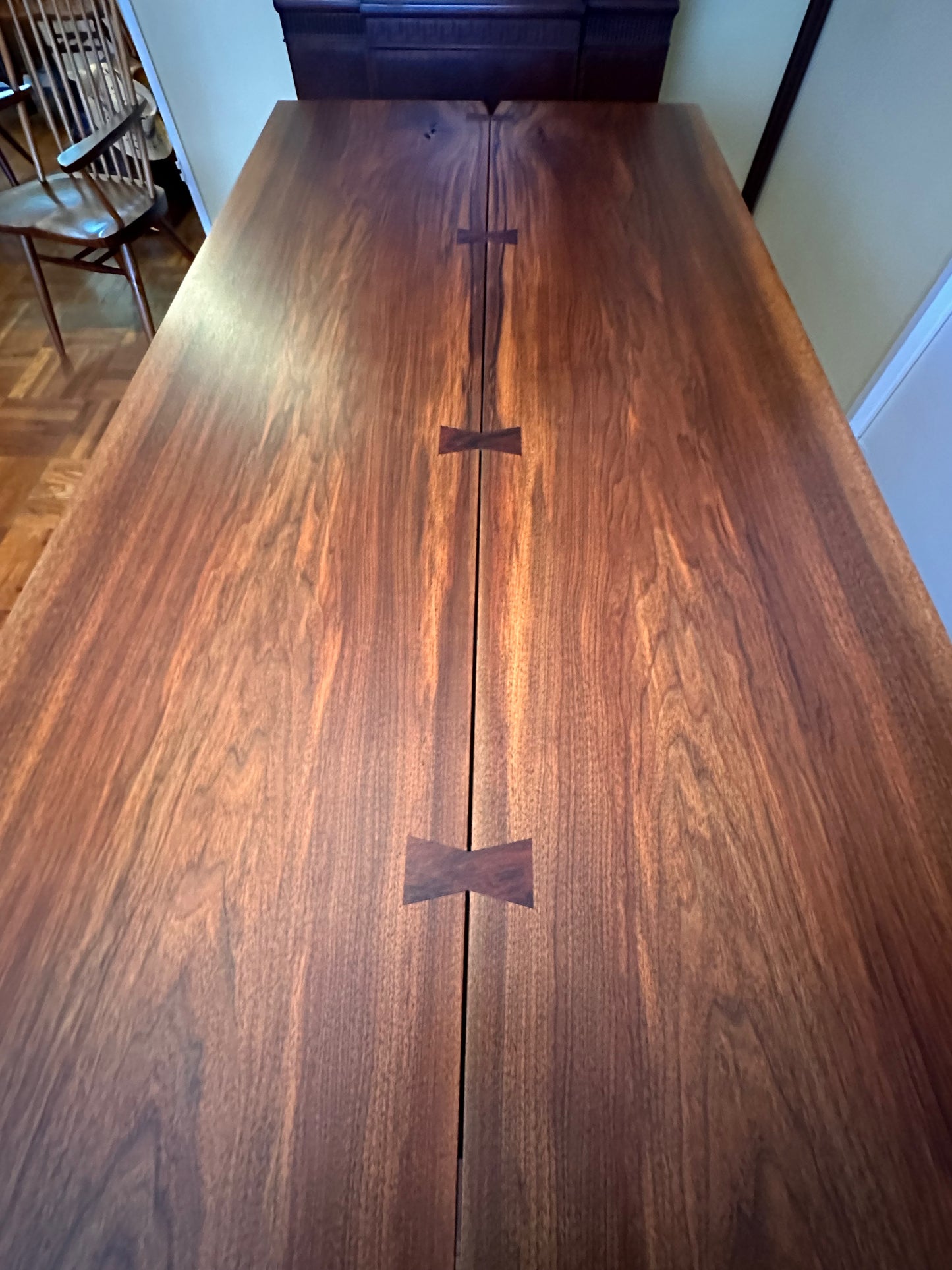 SOLD – George Nakashima 8' Dining Table in Bookmatched Walnut with 5 Rosewood Butterfly