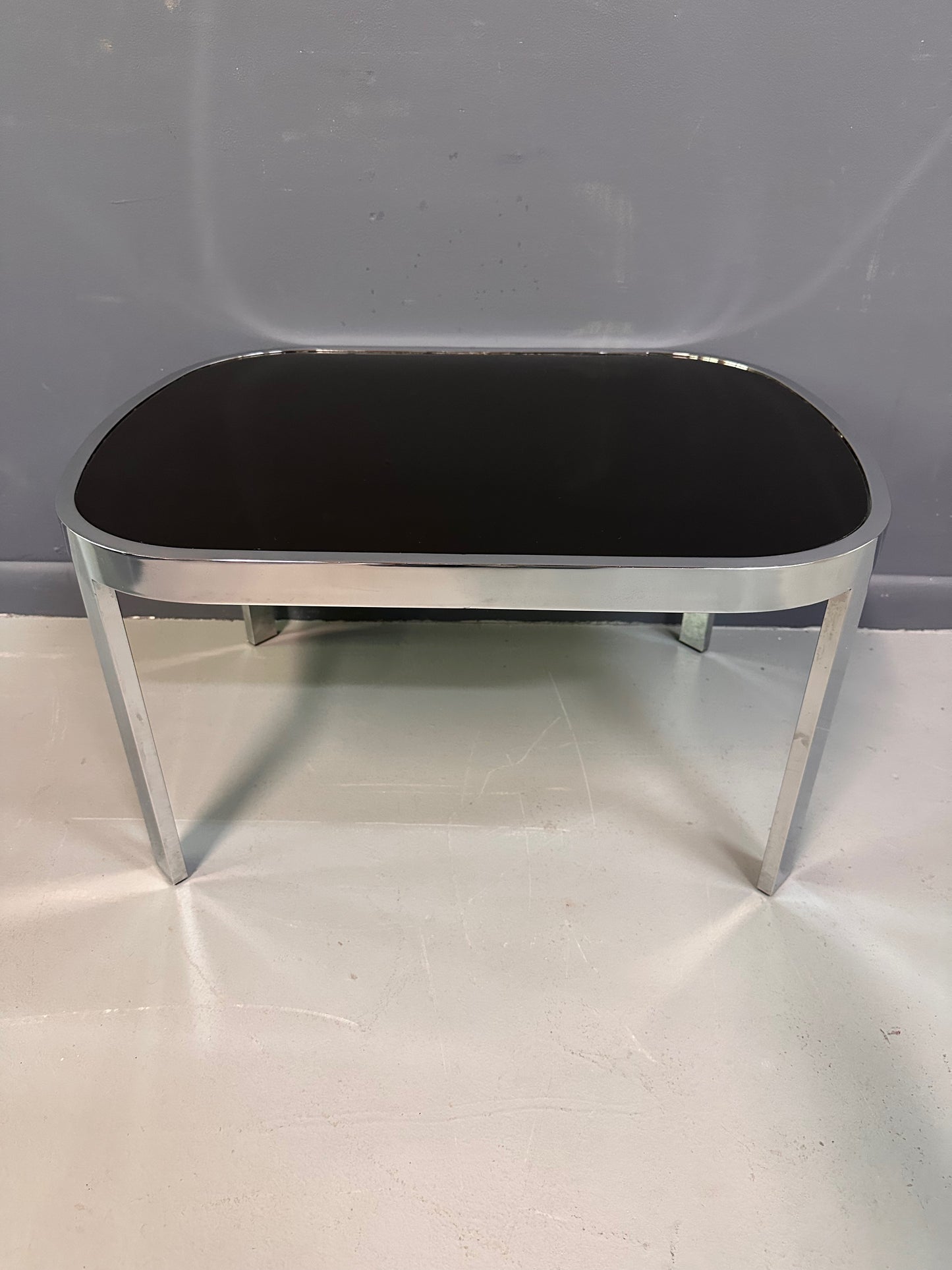SOLD – Milo Baughman Black Glass Racetrack Side Table for Design Institute of America