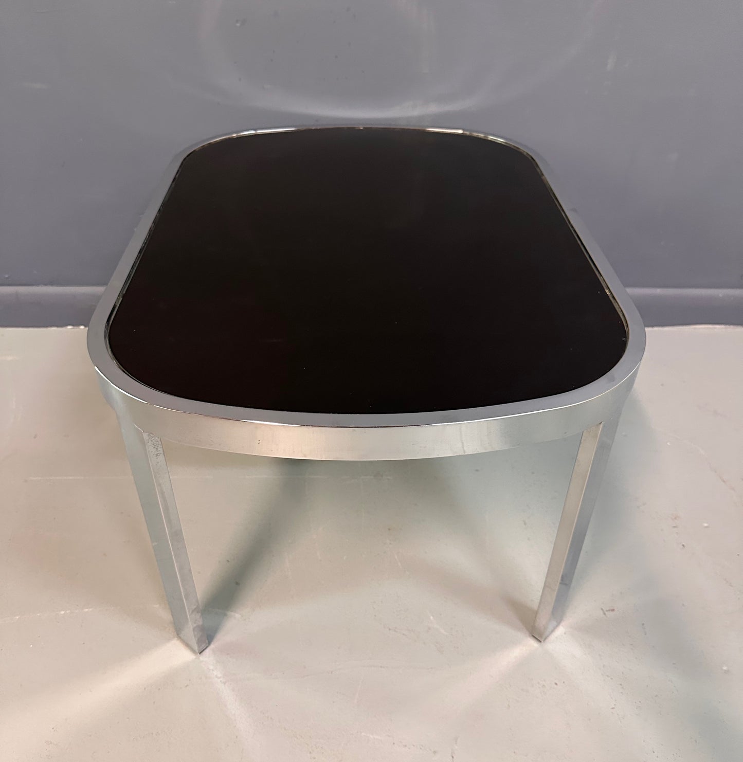 SOLD – Milo Baughman Black Glass Racetrack Side Table for Design Institute of America