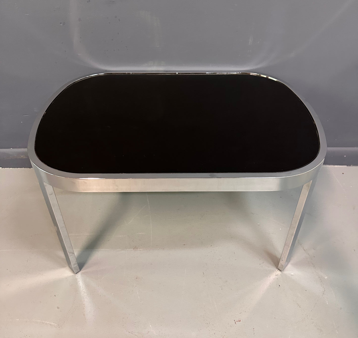 SOLD – Milo Baughman Black Glass Racetrack Side Table for Design Institute of America