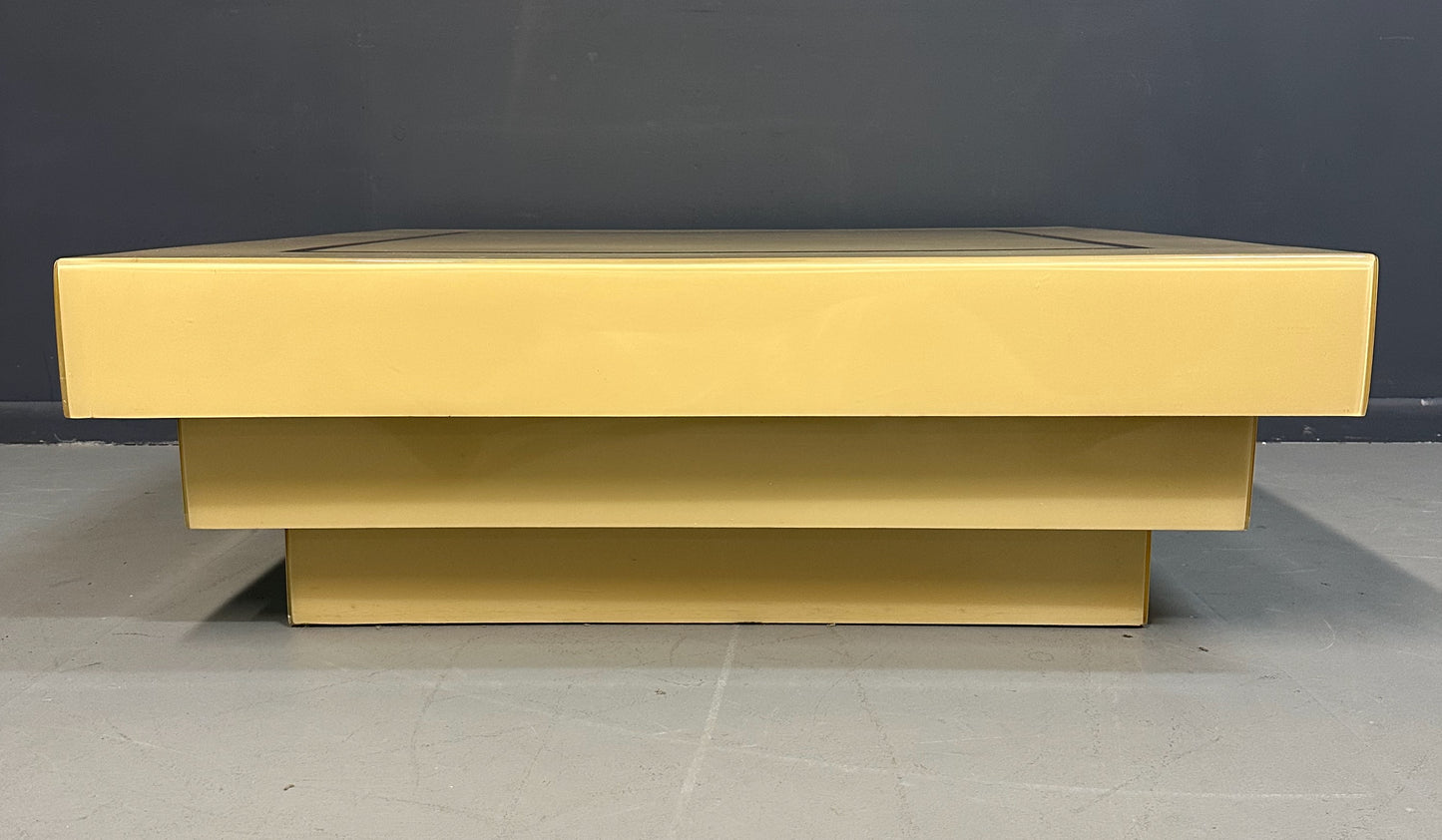 1970s Acrylic Stepped Cream Colored Coffee Table with Brass Ribbon Inlay