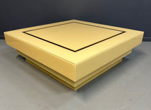 Load image into Gallery viewer, 1970s Acrylic Stepped Cream Colored Coffee Table with Brass Ribbon Inlay