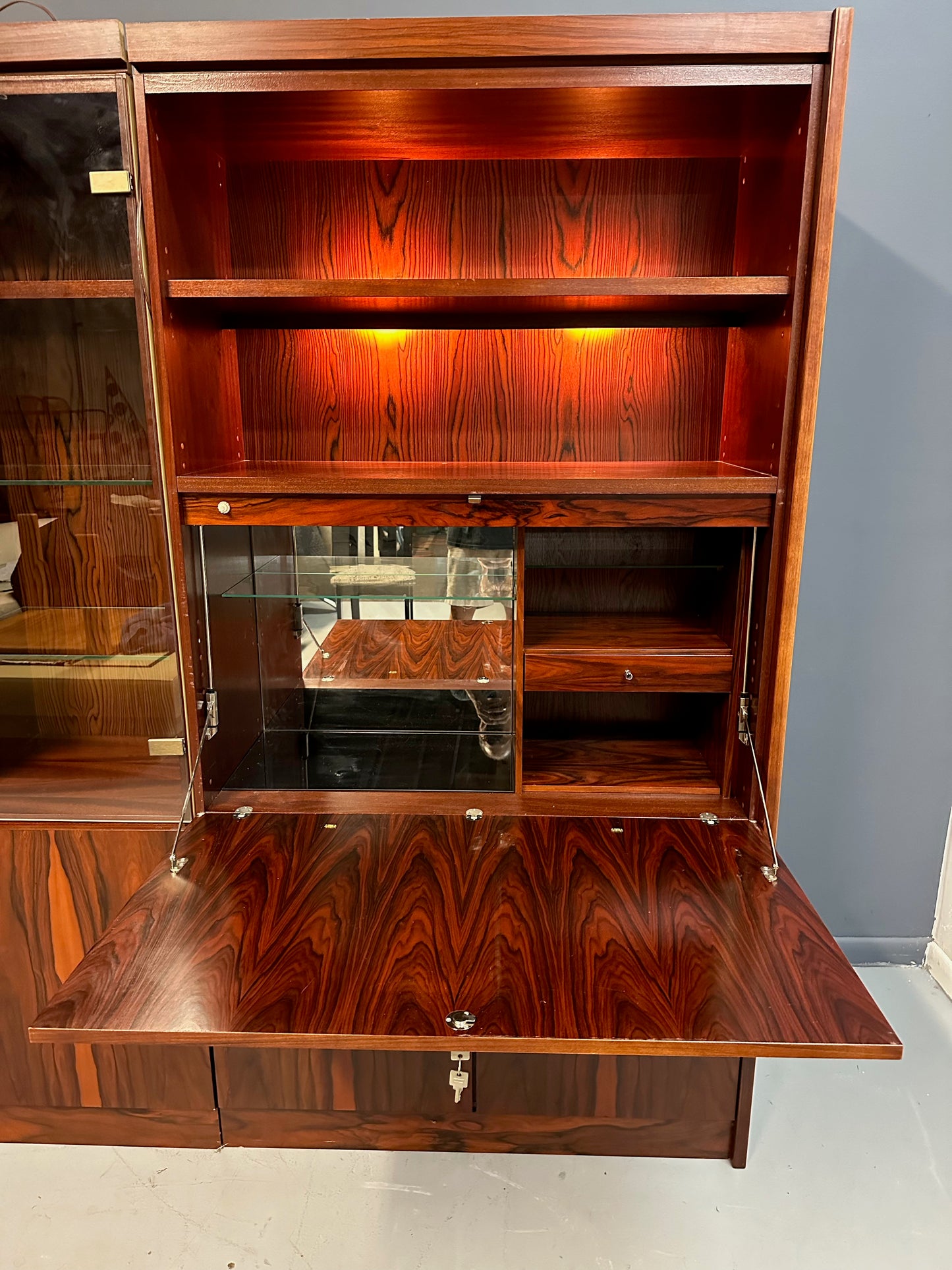SOLD – 1970s Planum Rosewood and Mahogany Lighted Wall Unit with Desk Mid Century