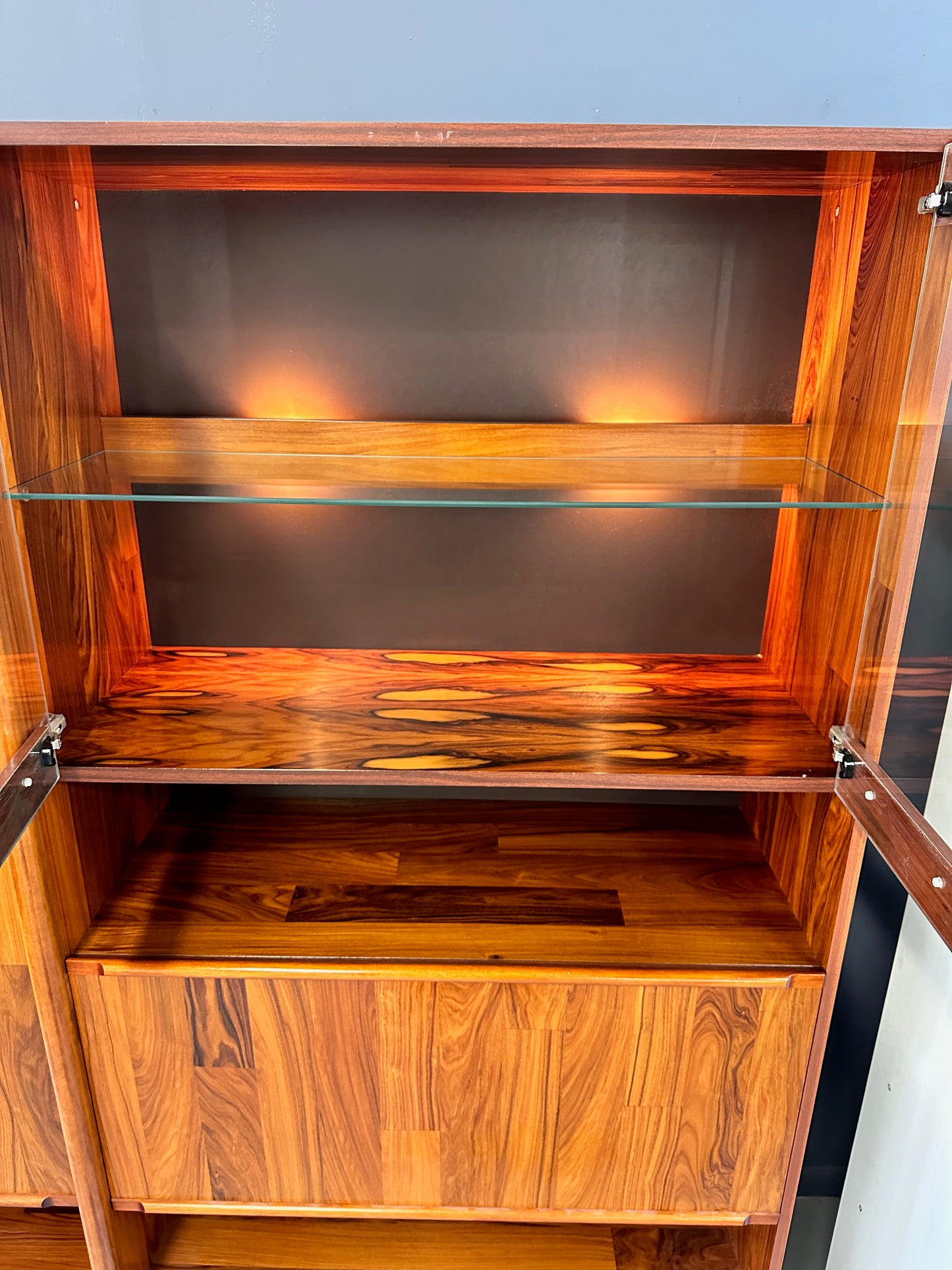 SOLD – 1980s Three Piece Lighted Rosewood Veneer Wall Unit the Style of Jorge Zalszupin