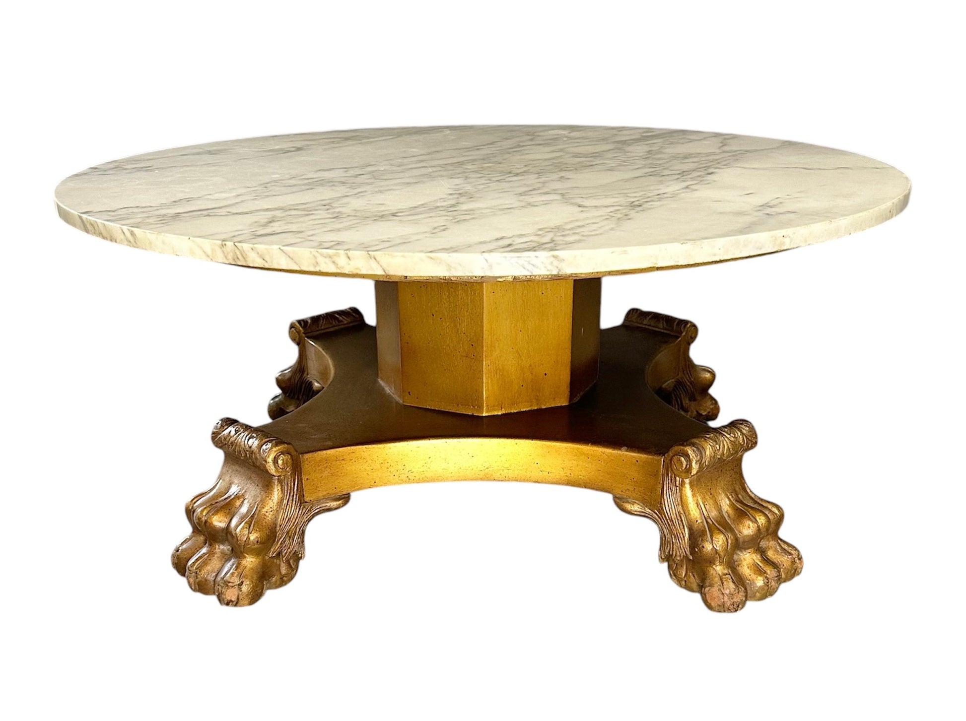 20th-century Empire-style Hollywood Regency coffee table featuring a round white marble top with elegant gray veining, supported by a gilded wood base with bold lion paw feet and neoclassical design elements