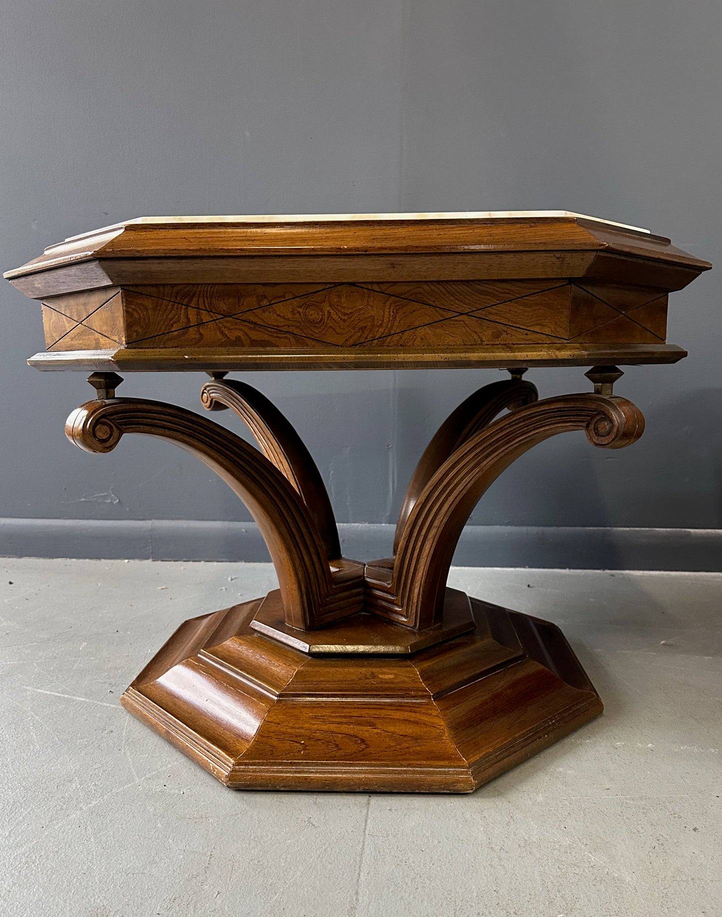 Pair of Hollywood Regency octagonal side tables featuring sculpted wooden bases and creamy Calacatta marble tops with elegant veining.