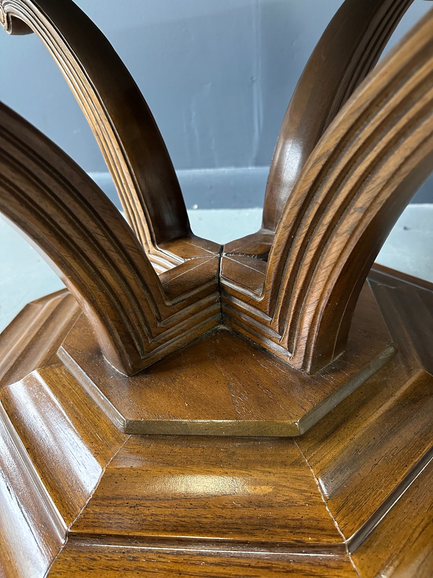 Pair of Hollywood Regency octagonal side tables featuring sculpted wooden bases and creamy Calacatta marble tops with elegant veining.