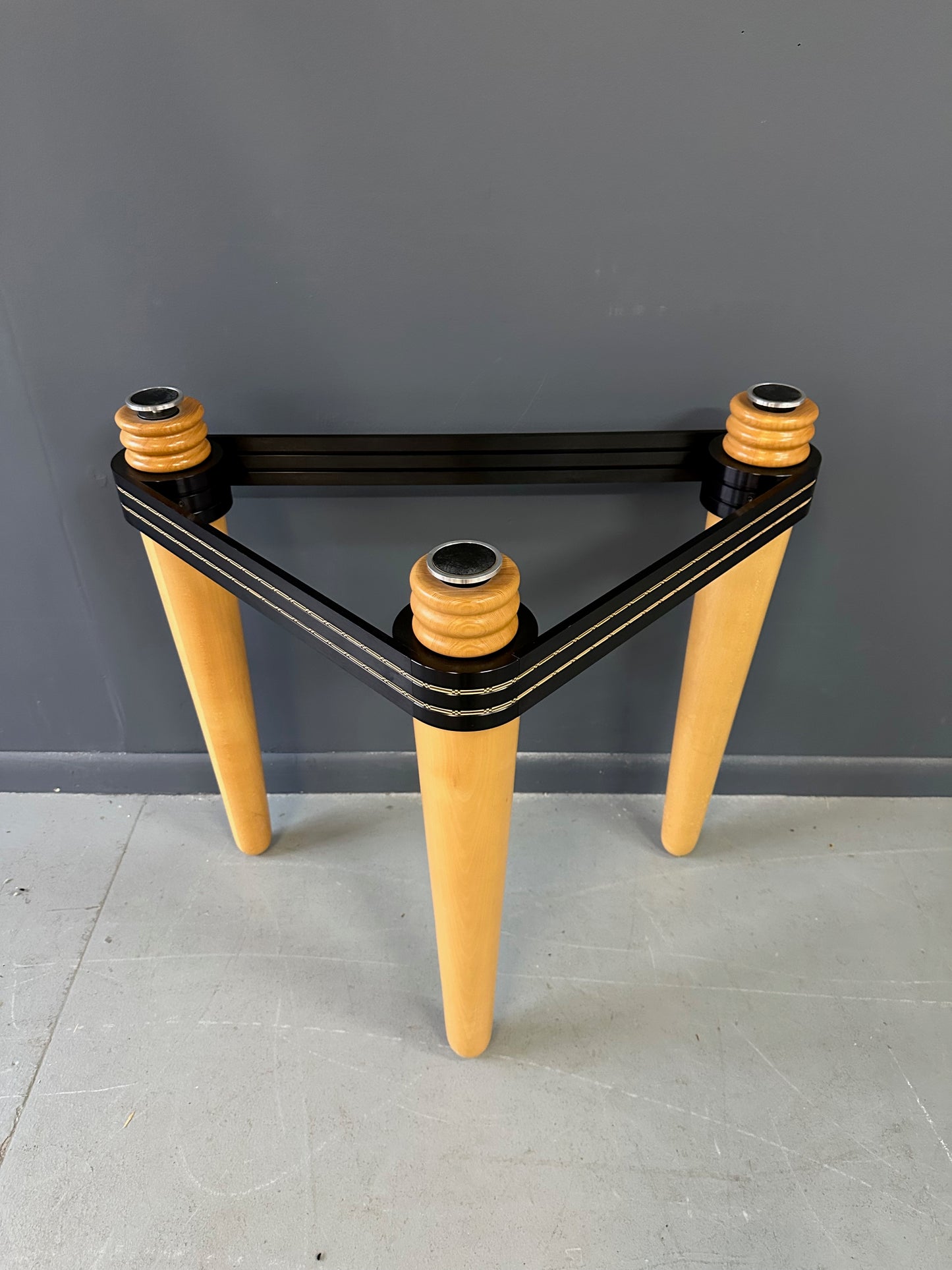 1990 demi-lune hall table designed by Kaiser Newman, featuring a curved green glass top, light beech wood legs, and a black lacquered frame with white inlay detailing