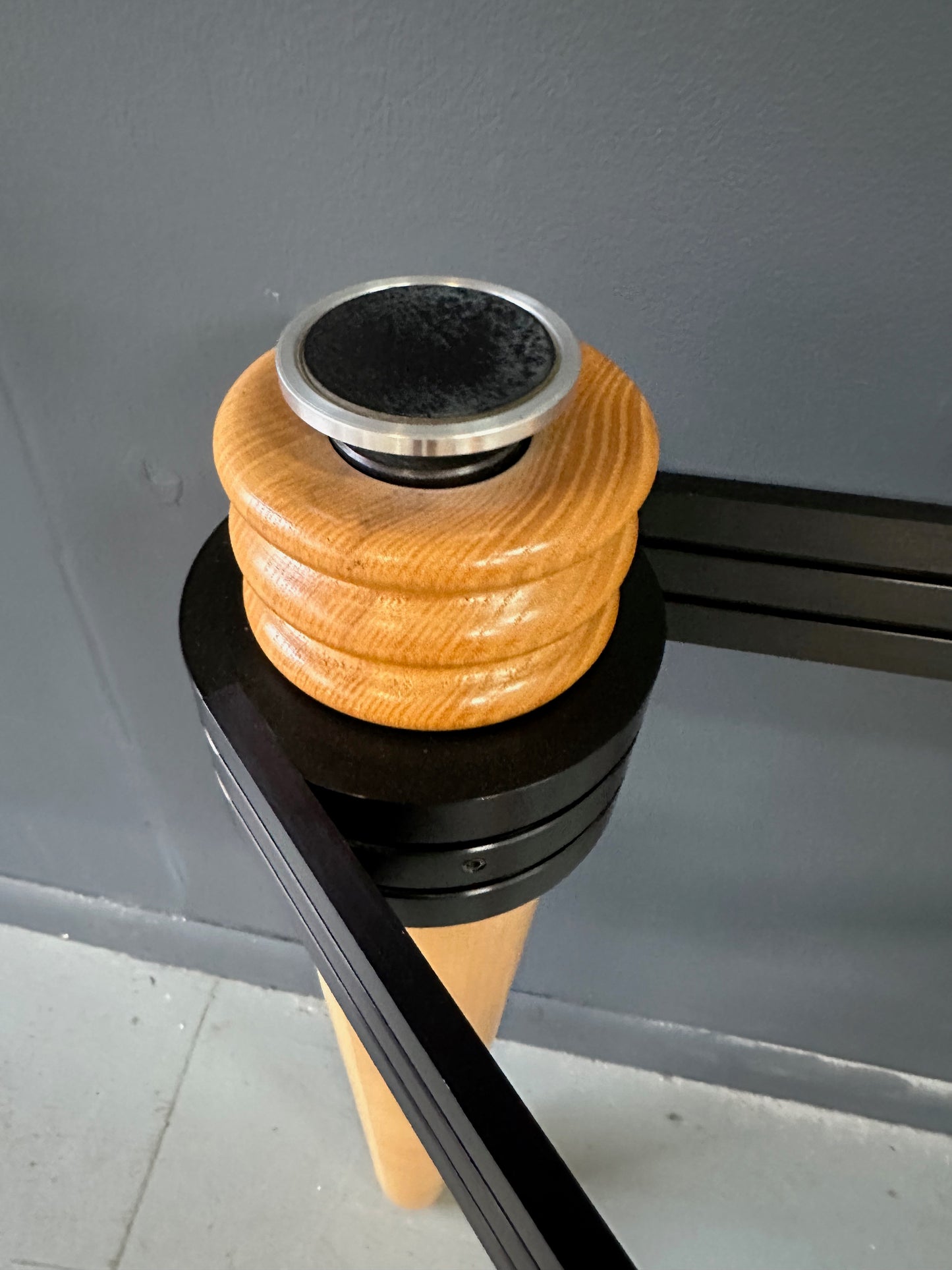 1990 demi-lune hall table designed by Kaiser Newman, featuring a curved green glass top, light beech wood legs, and a black lacquered frame with white inlay detailing