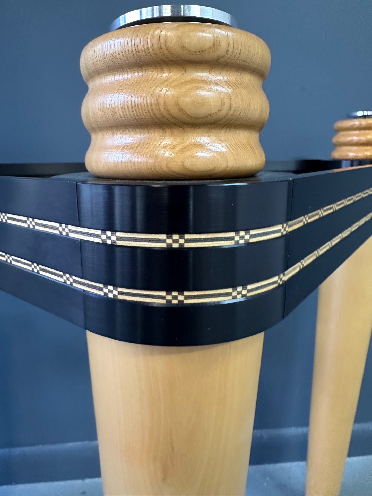 1990 demi-lune hall table designed by Kaiser Newman, featuring a curved green glass top, light beech wood legs, and a black lacquered frame with white inlay detailing