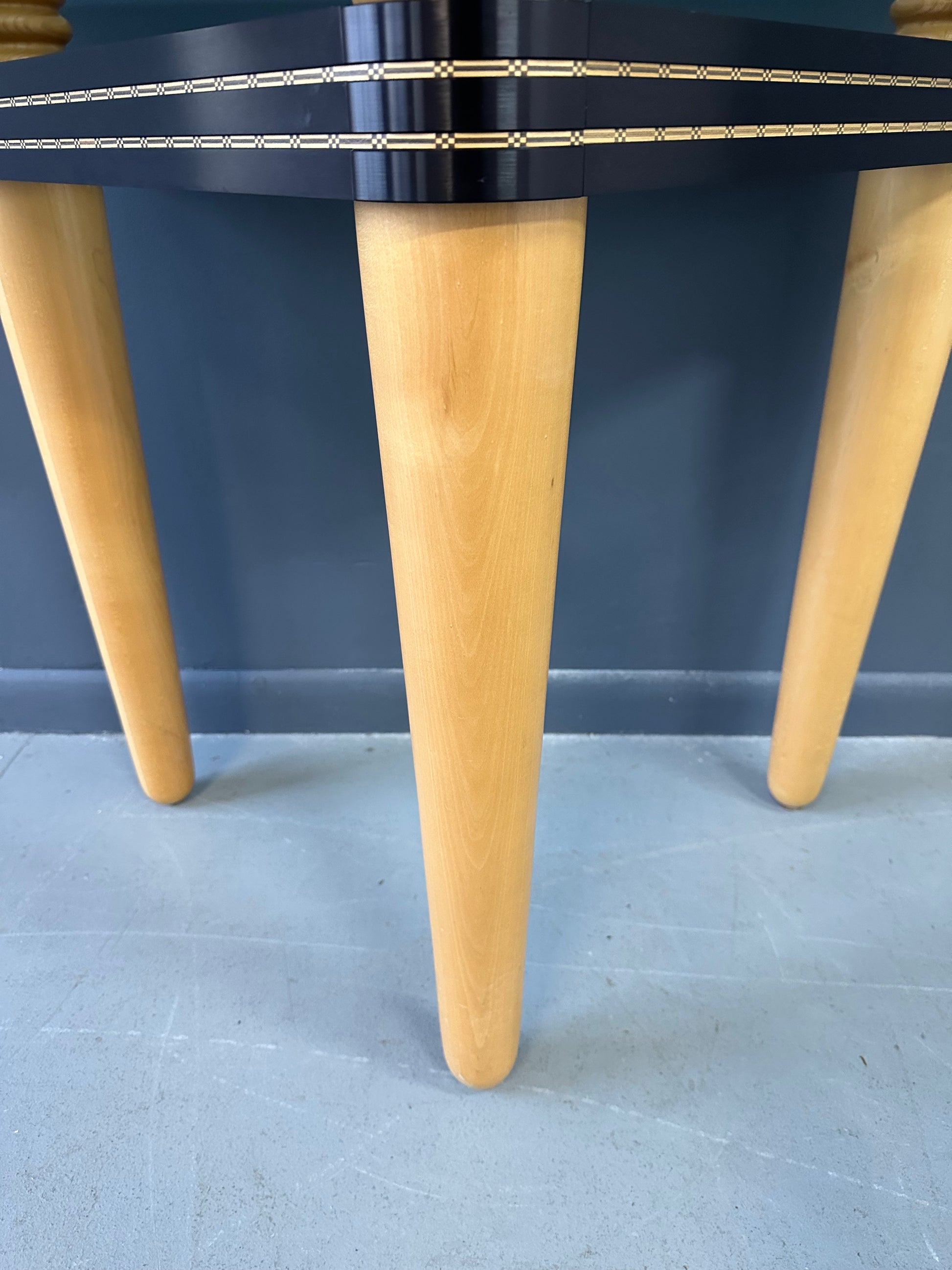 1990 demi-lune hall table designed by Kaiser Newman, featuring a curved green glass top, light beech wood legs, and a black lacquered frame with white inlay detailing