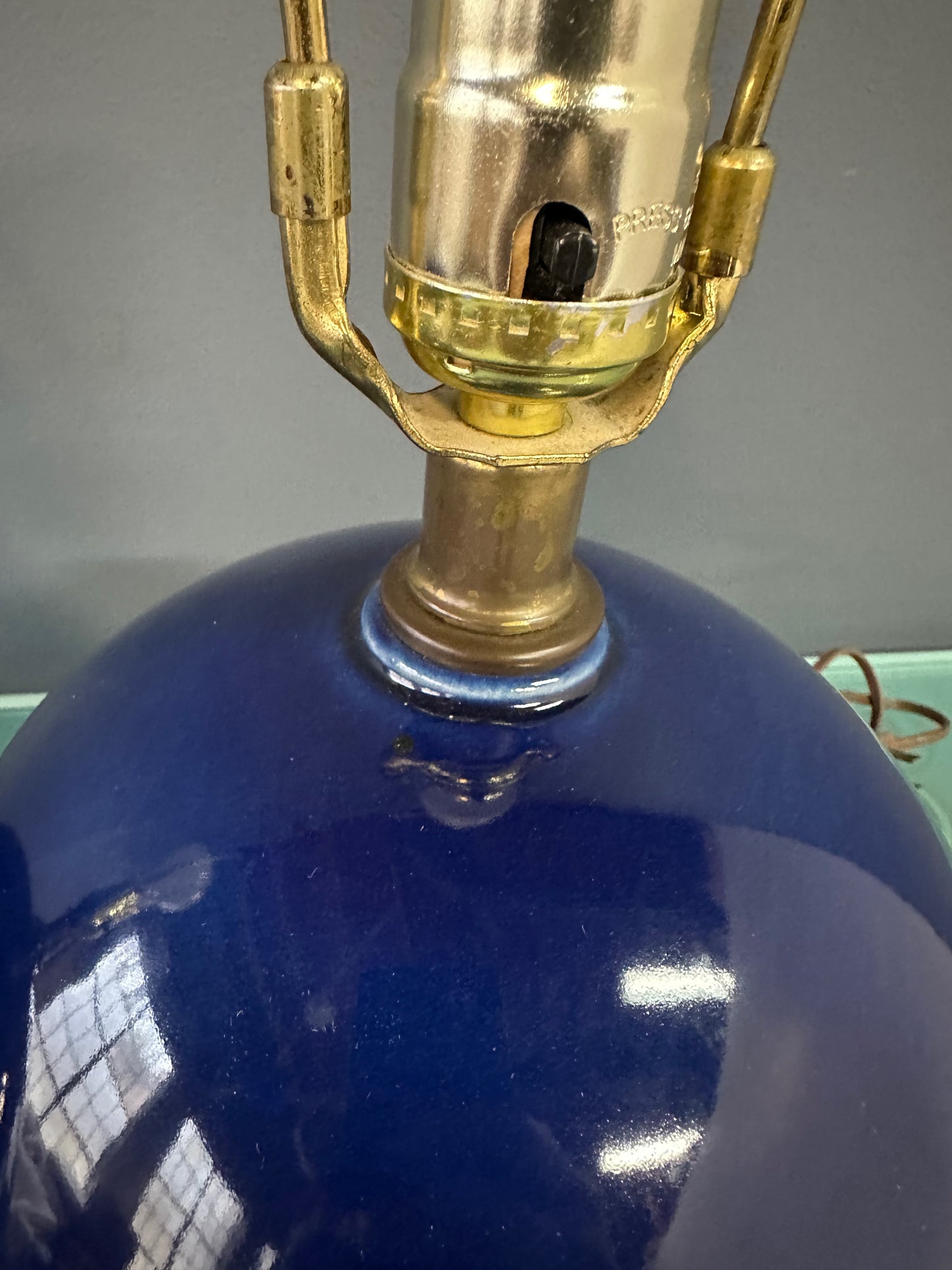Pair of Mid-Century Mar-Kel Lighting Table Lamps Featuring Deep Blue Spherical Glazed Ceramic Bases with Brass Hardware and Harps