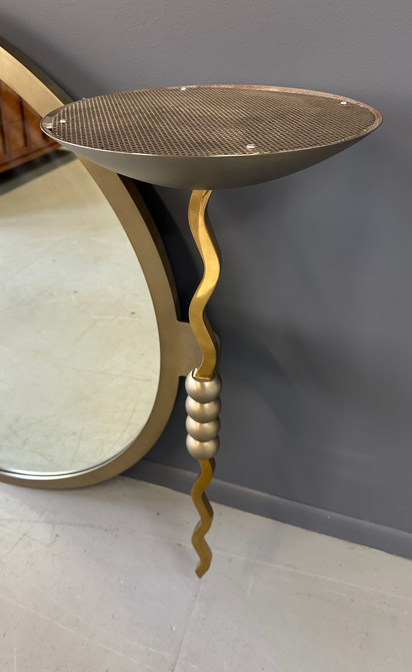 Brueton Large Postmodern 'Fist' Mirror Designed by Stanley Jay Friedman, Featuring Round Mirror with Sculptural Brass Candle Sconces