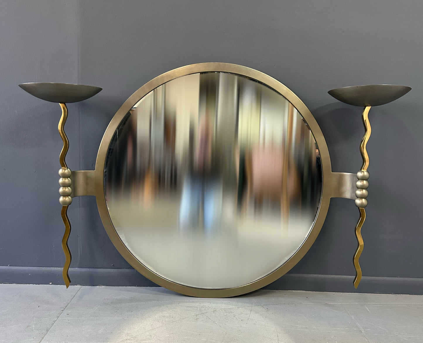 Brueton Large Postmodern 'Fist' Mirror Designed by Stanley Jay Friedman, Featuring Round Mirror with Sculptural Brass Candle Sconces