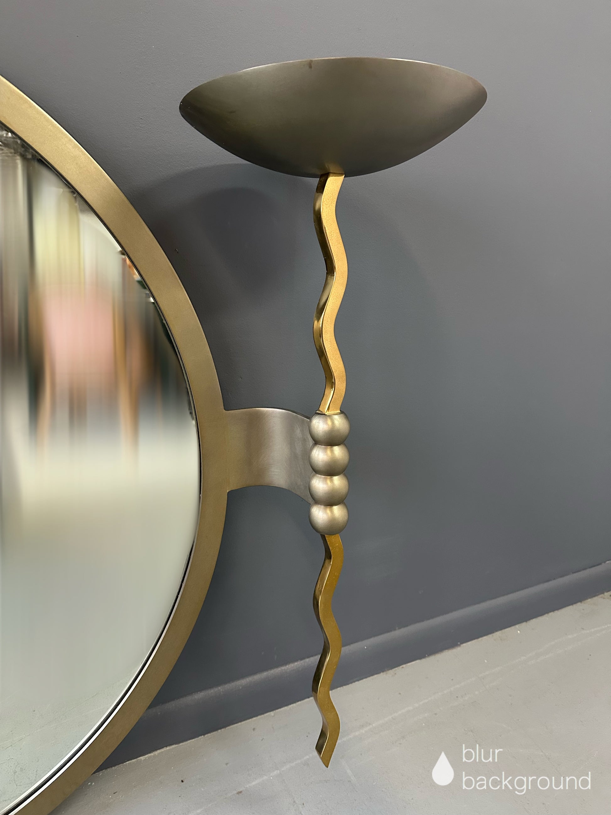Brueton Large Postmodern 'Fist' Mirror Designed by Stanley Jay Friedman, Featuring Round Mirror with Sculptural Brass Candle Sconces