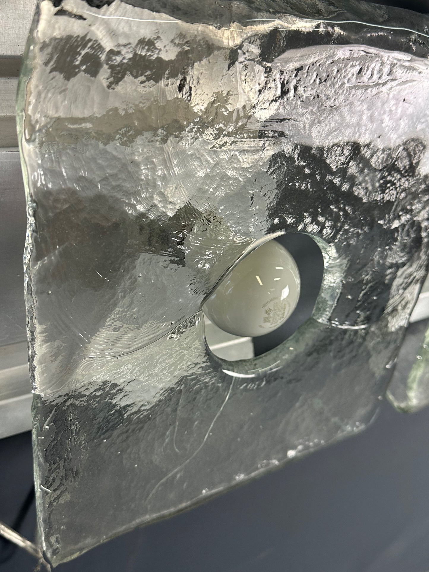 Set of two vintage 1960s Carlo Nason for Kalmar Franken glass wall lights featuring textured square glass shades mounted on a horizontal metal fixture