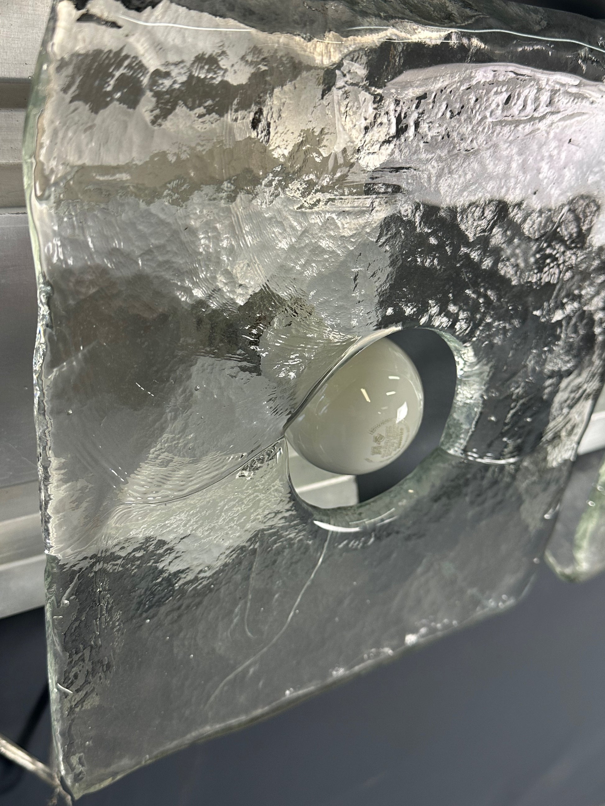 Set of two vintage 1960s Carlo Nason for Kalmar Franken glass wall lights featuring textured square glass shades mounted on a horizontal metal fixture