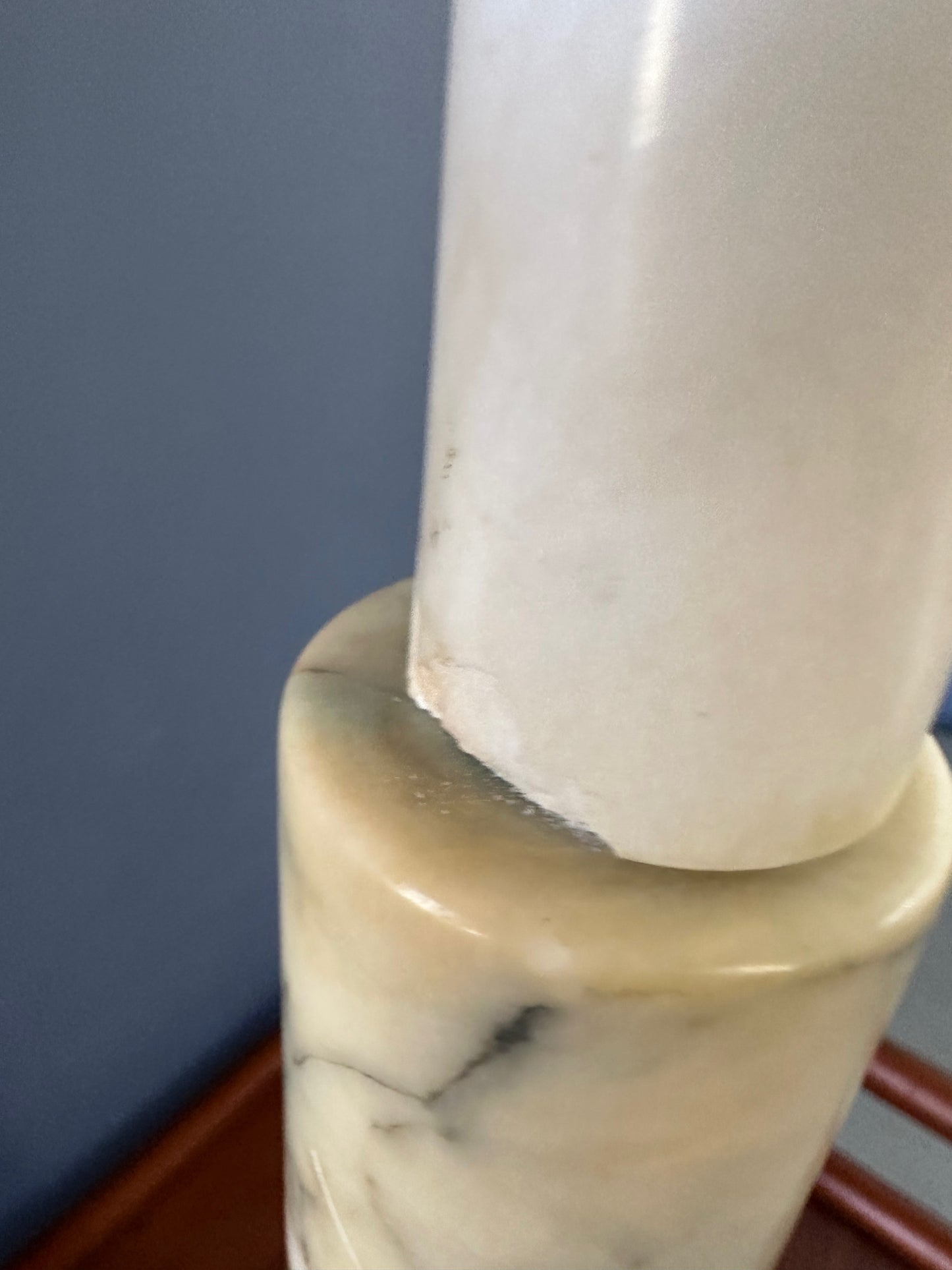 Mid-century Italian tall table lamp featuring a stacked marble design in blue, green, and beige tones, with a slender neck 