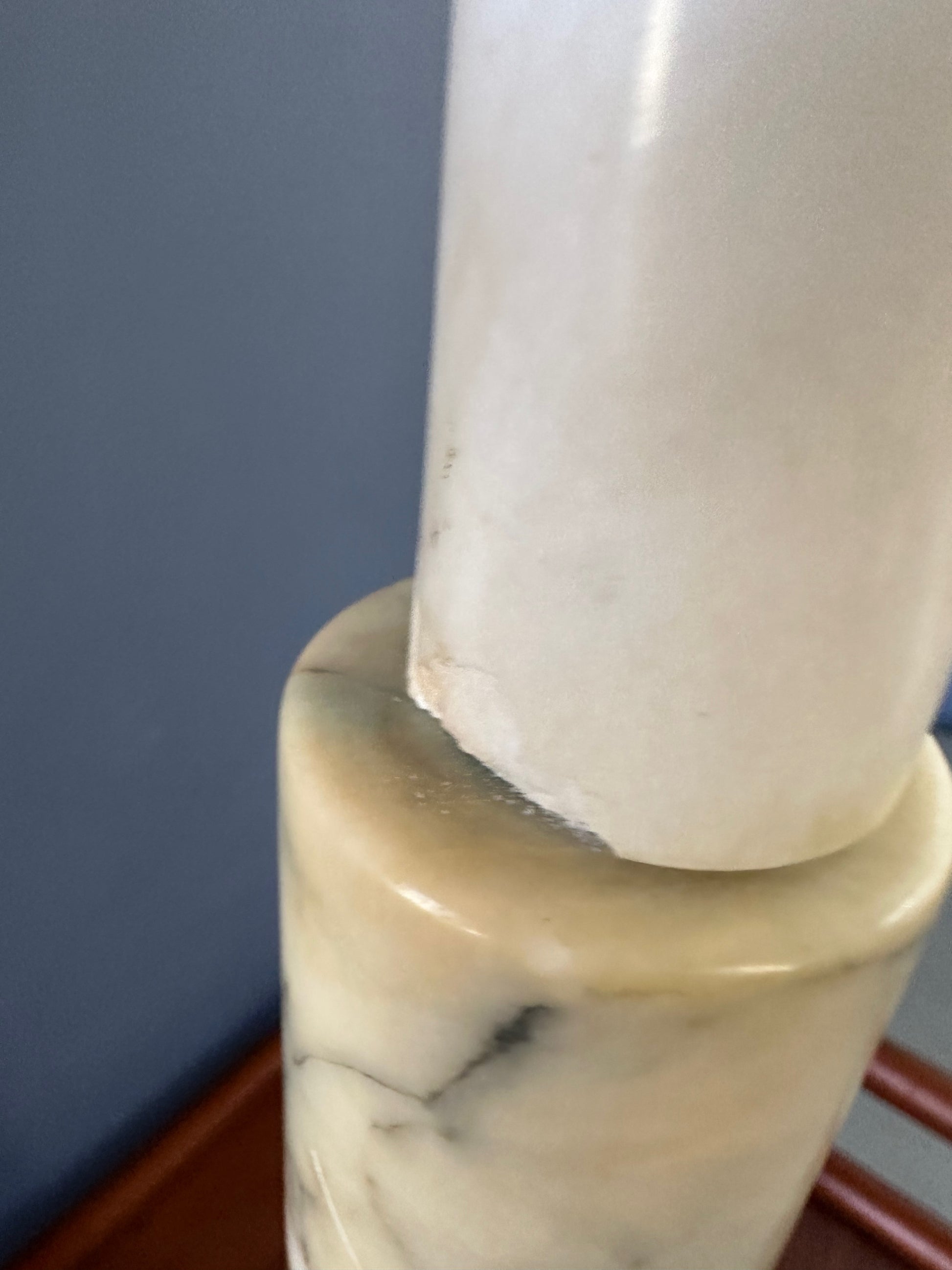 Mid-century Italian tall table lamp featuring a stacked marble design in blue, green, and beige tones, with a slender neck 