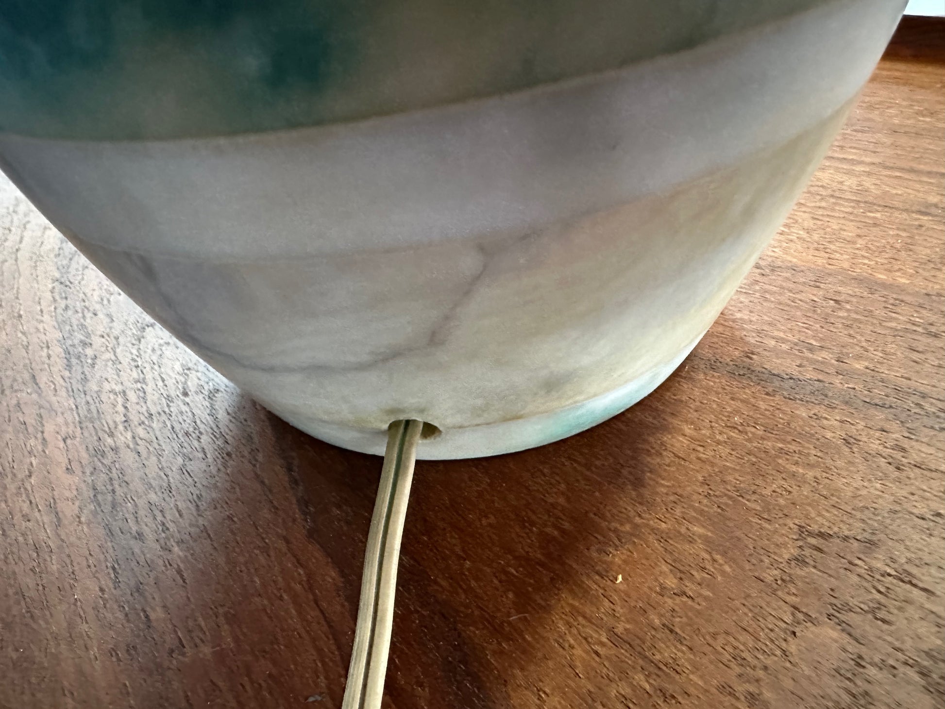 Mid-century Italian tall table lamp featuring a stacked marble design in blue, green, and beige tones, with a slender neck 