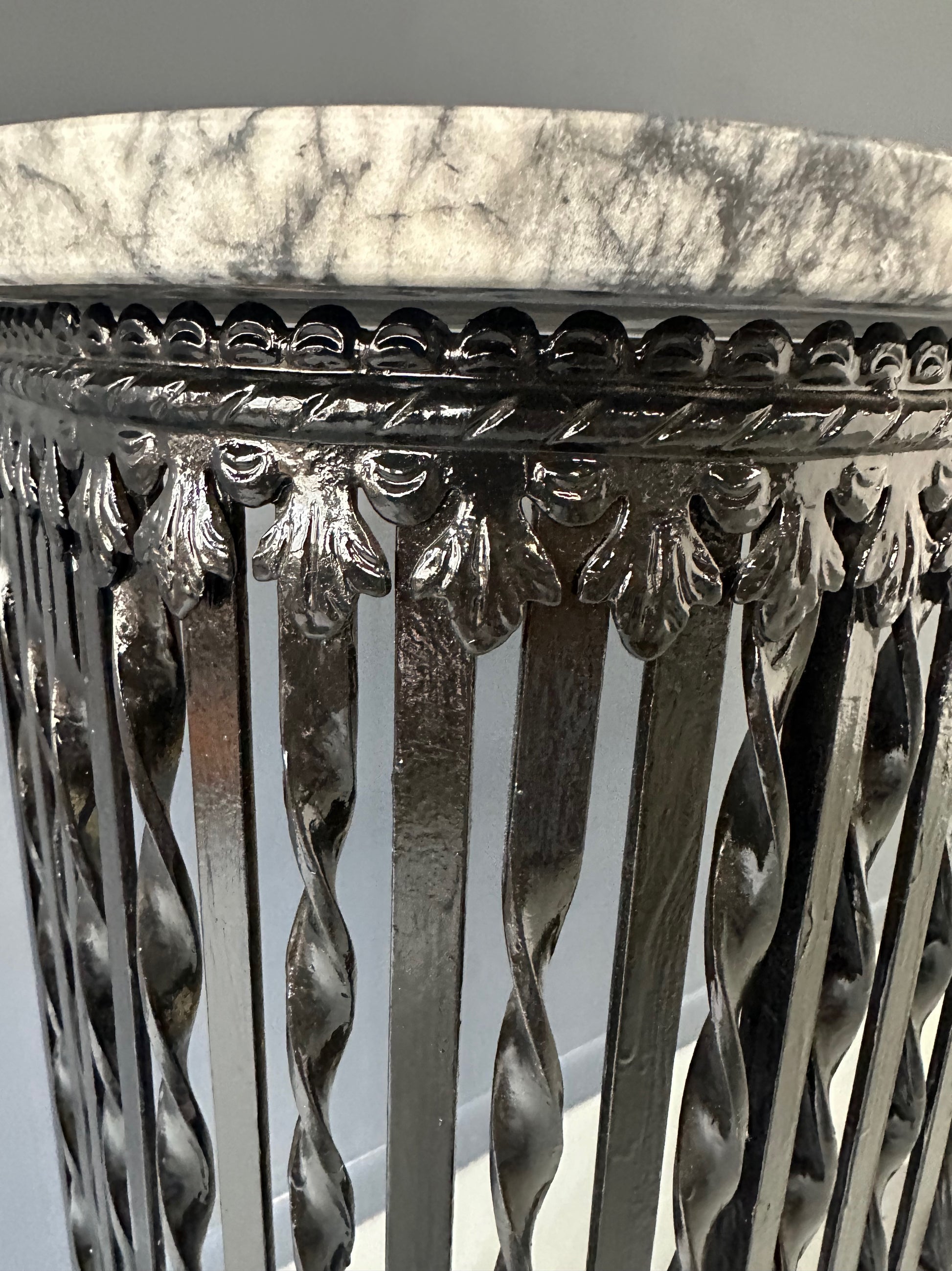 Late 19th-century antique radiator cover with ornate wrought iron design and marble slab top, Victorian style