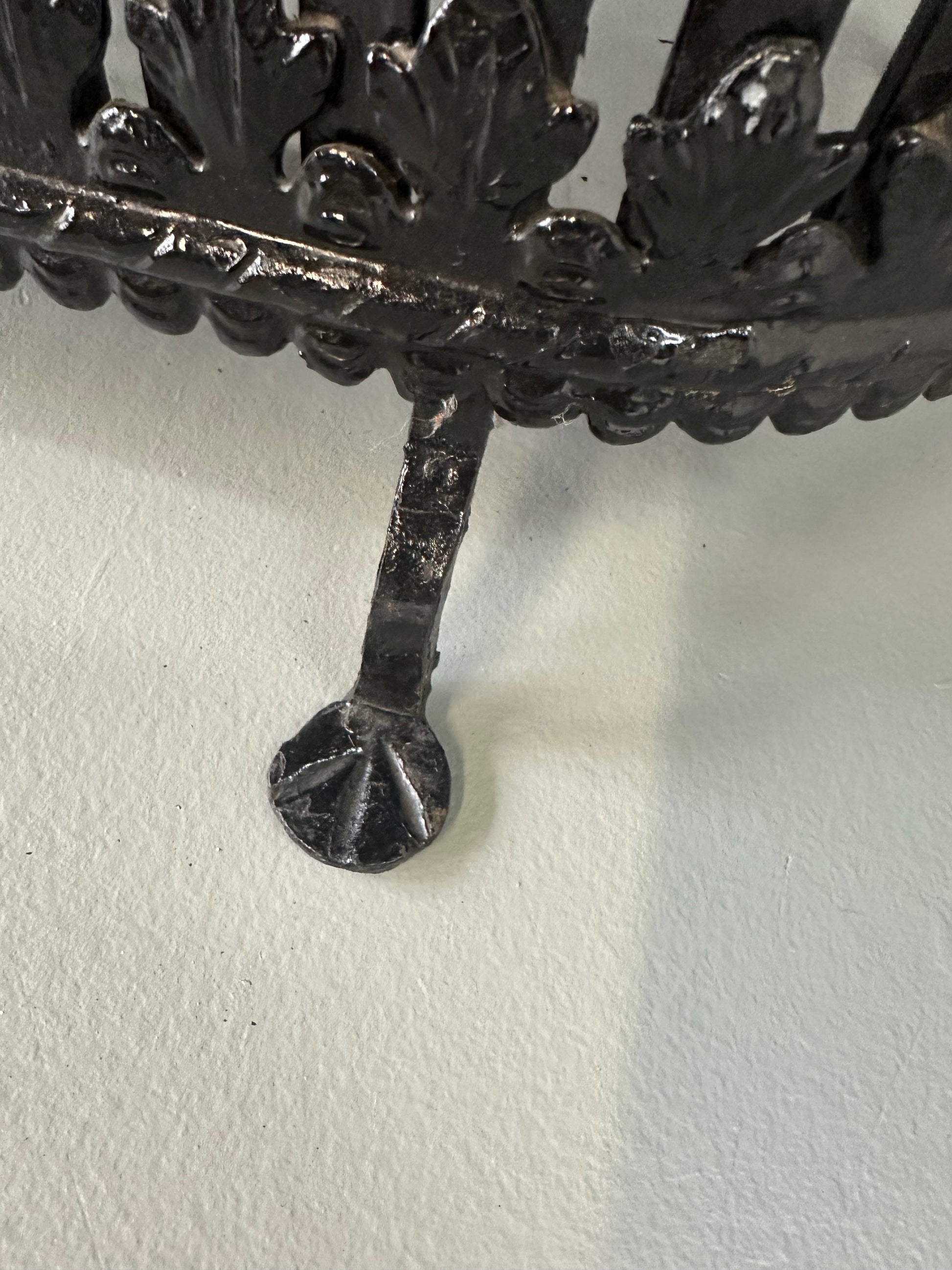 Late 19th-century antique radiator cover with ornate wrought iron design and marble slab top, Victorian style