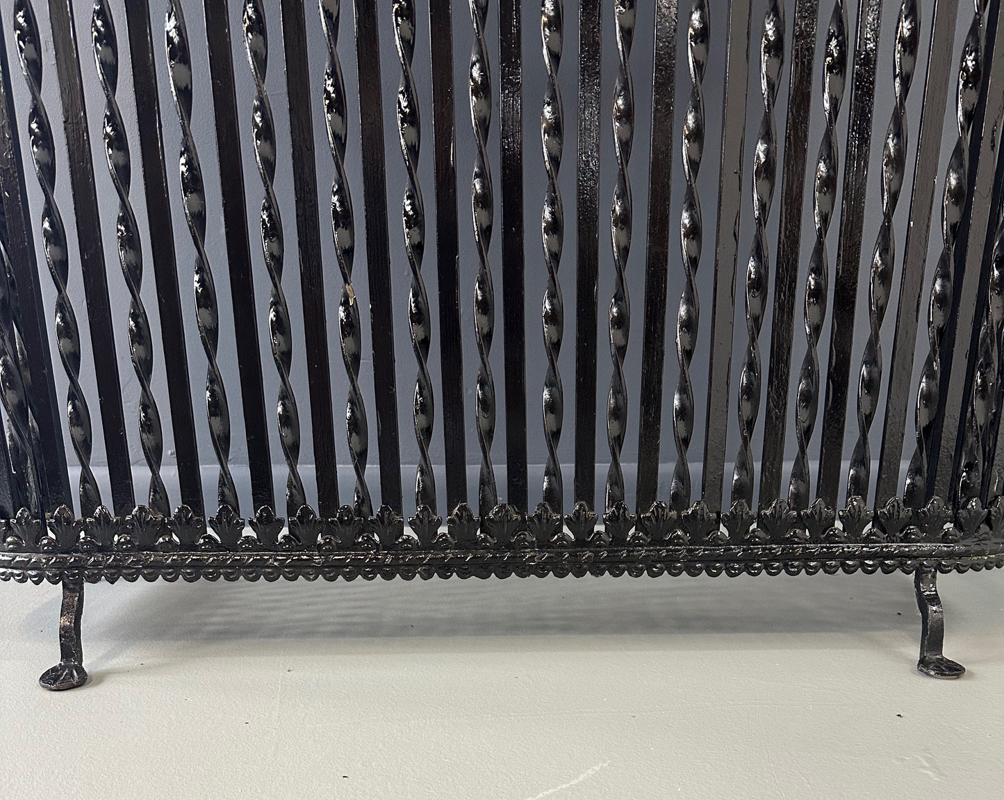 Late 19th-century antique radiator cover with ornate wrought iron design and marble slab top, Victorian style