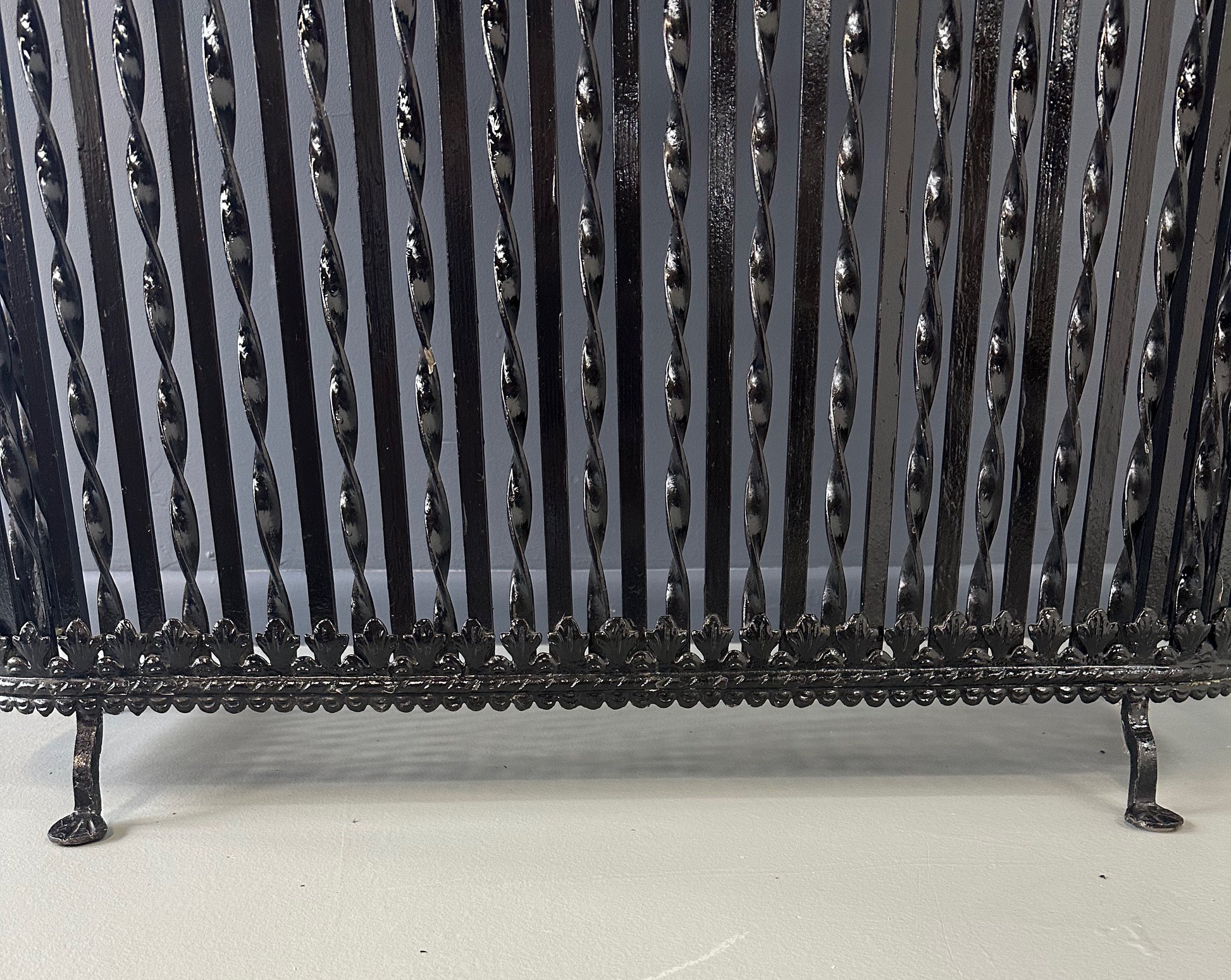 Late 19th-century antique radiator cover with ornate wrought iron design and marble slab top, Victorian style