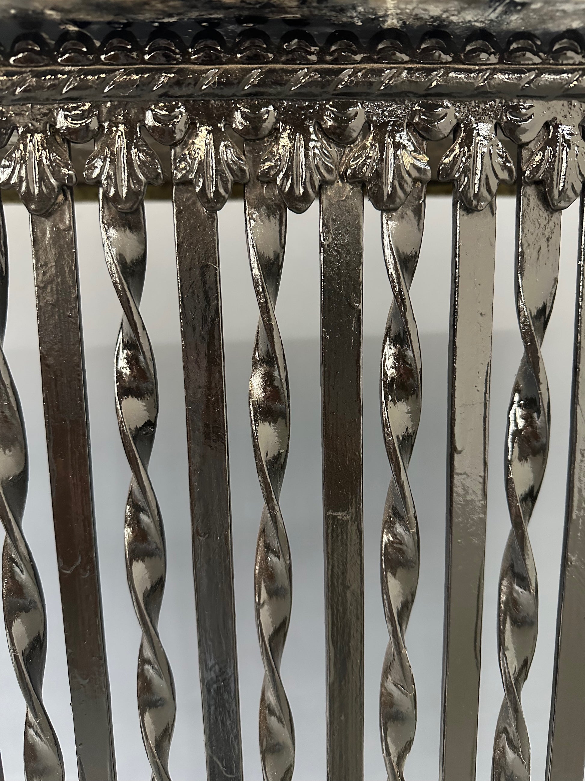 Late 19th-century antique radiator cover with ornate wrought iron design and marble slab top, Victorian style