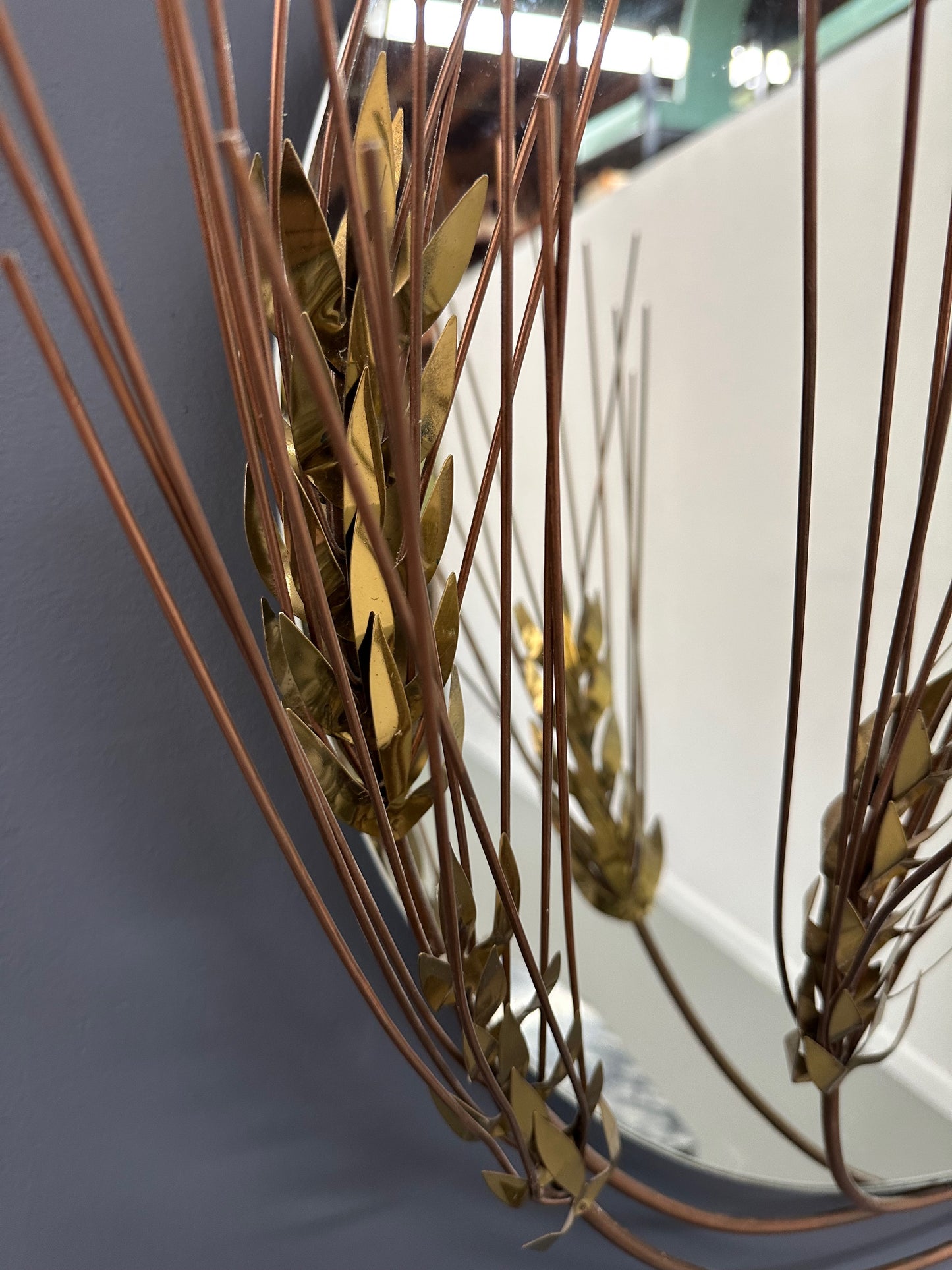 Vintage 1981 Curtis Jere round wall mirror with brass wheat stalk design, mid-century modern decor
