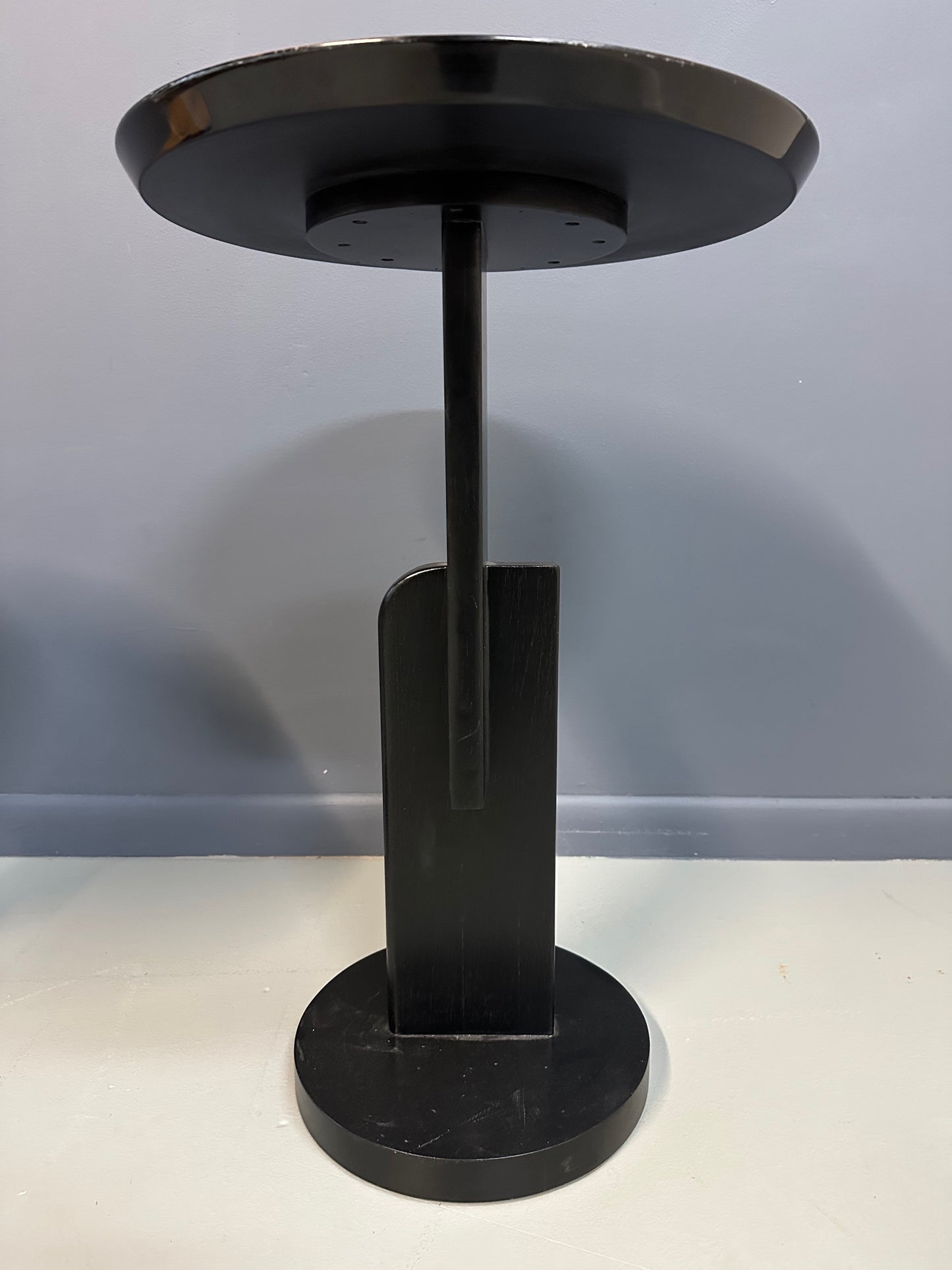Pair of Carlo Malnati style Postmodern side tables featuring round inlaid wood tops with abstract, multicolored organic patterns and sleek black pedestal bases.