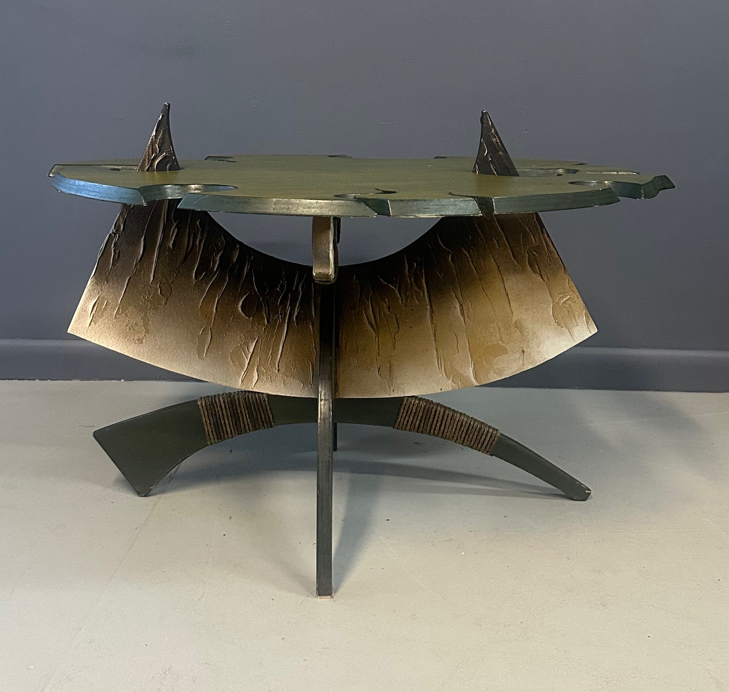 Brutalist handmade coffee table with jagged edges and Asian design elements
