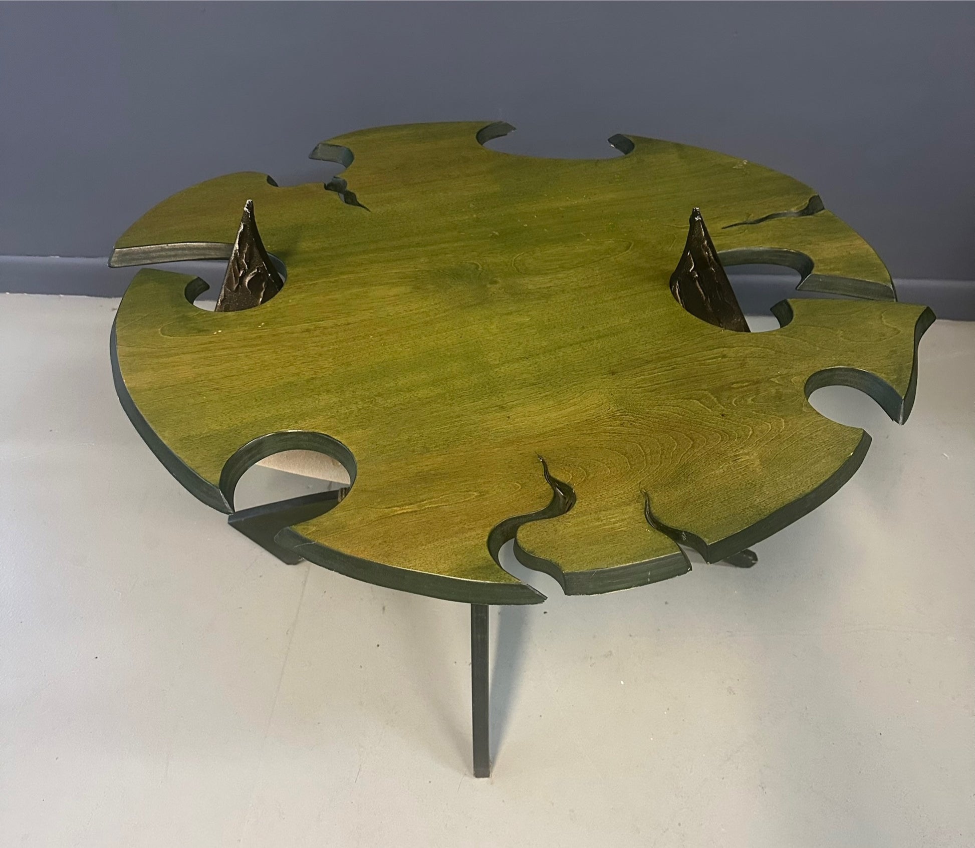 Brutalist handmade coffee table with jagged edges and Asian design elements