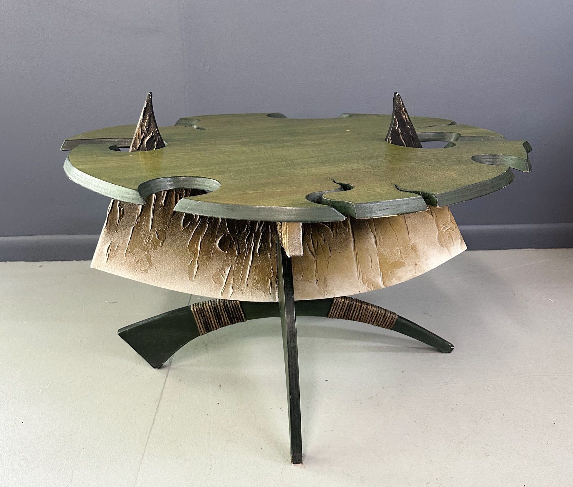 Brutalist handmade coffee table with jagged edges and Asian design elements