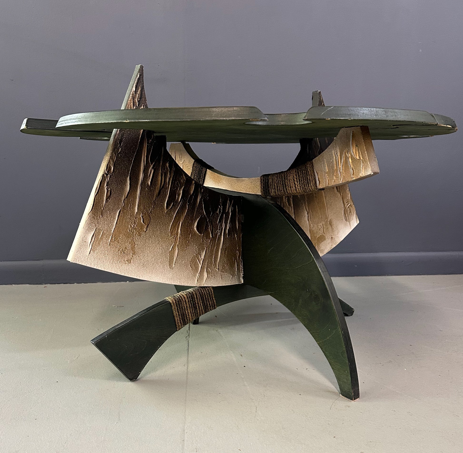 Brutalist handmade coffee table with jagged edges and Asian design elements