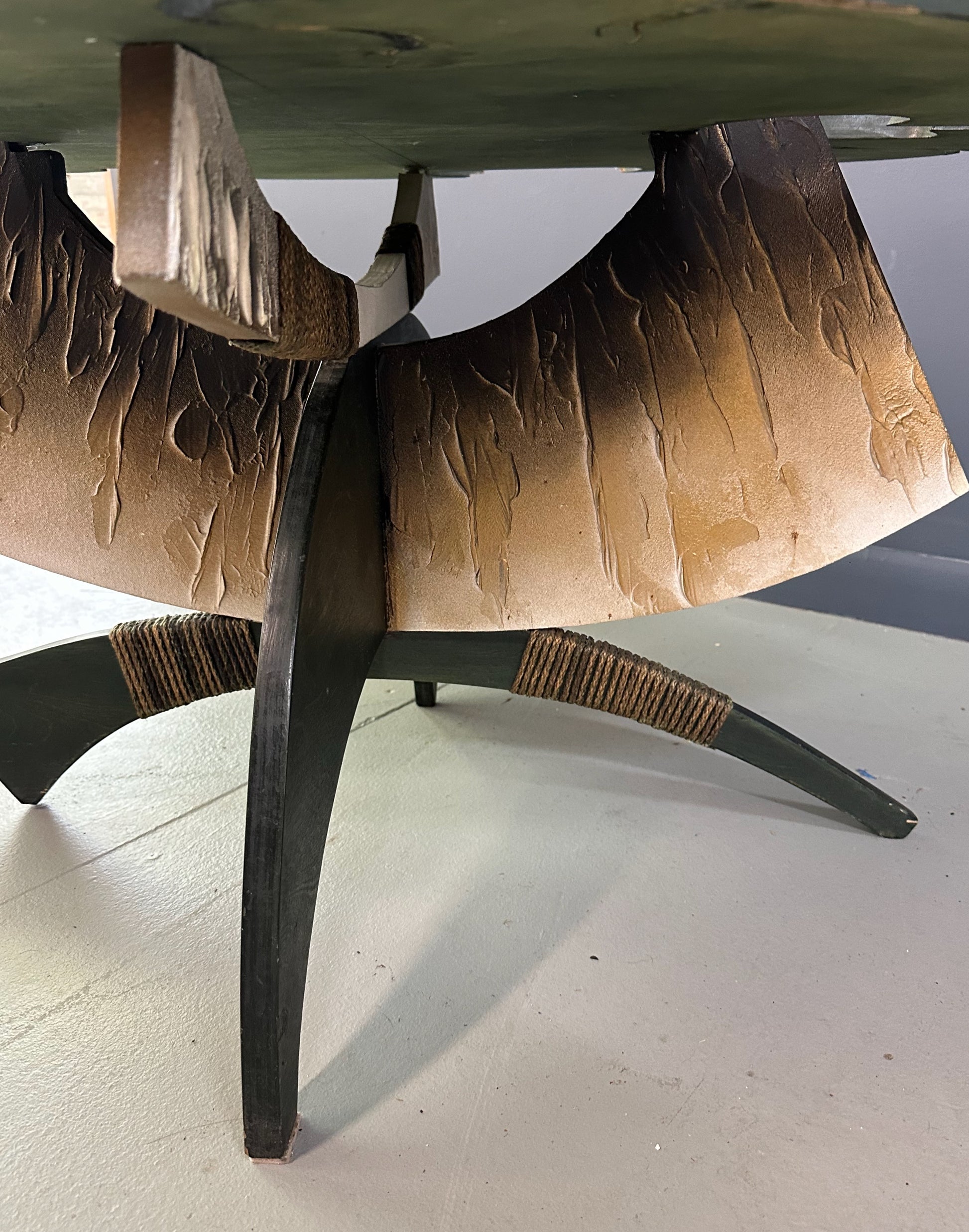 Brutalist handmade coffee table with jagged edges and Asian design elements