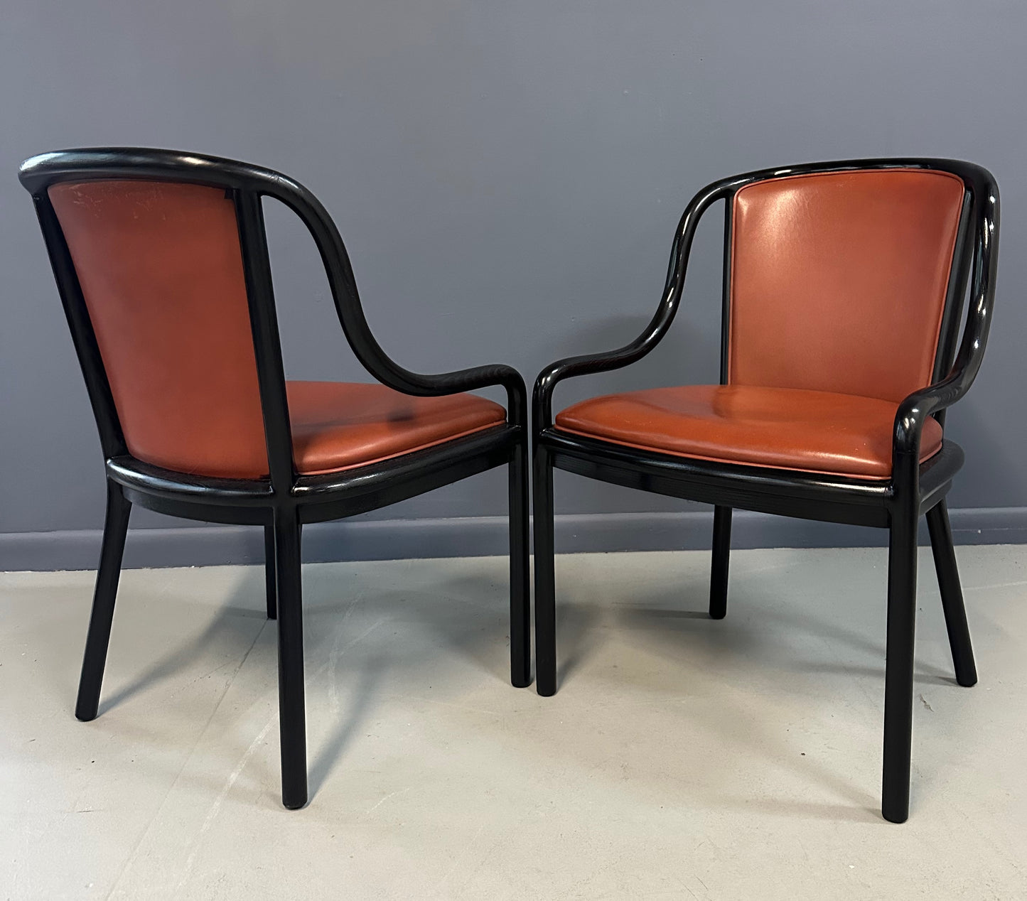 Set of four rare 1970s Ward Bennett Landmark Variation chairs for Brickel Associates, featuring black lacquered frames and rust leather upholstery—mid-century modern design