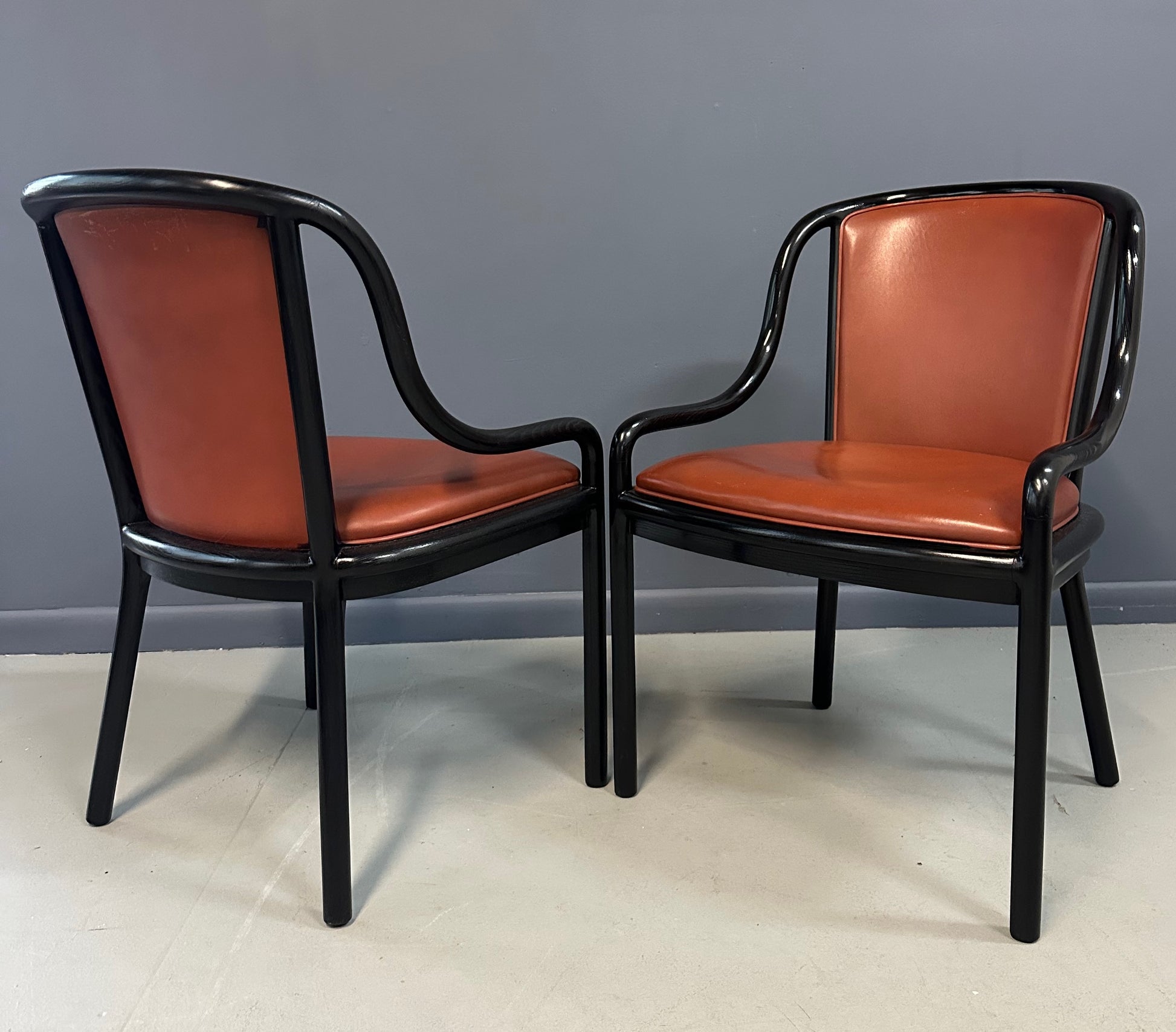 Set of four rare 1970s Ward Bennett Landmark Variation chairs for Brickel Associates, featuring black lacquered frames and rust leather upholstery—mid-century modern design