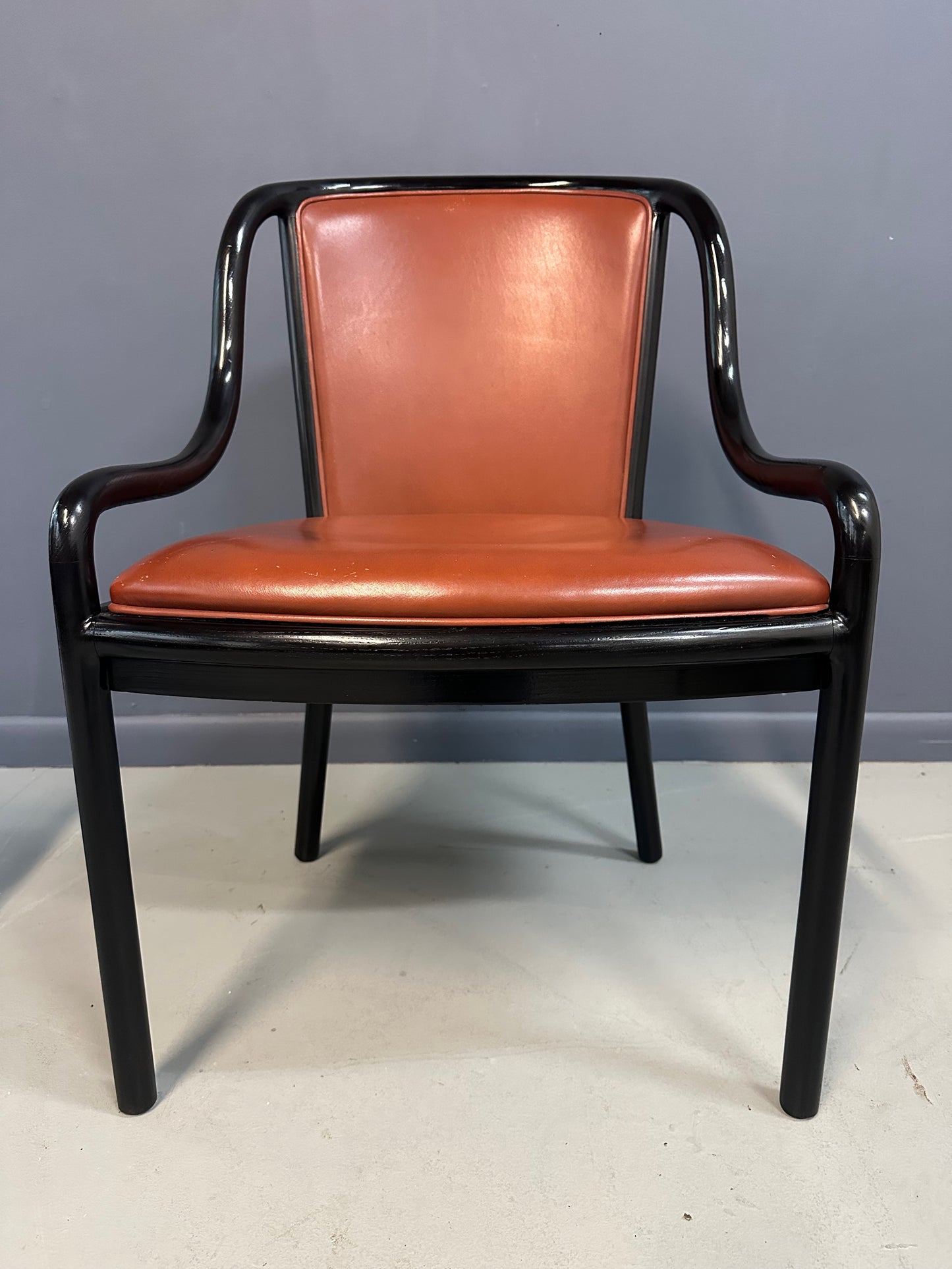 Set of four rare 1970s Ward Bennett Landmark Variation chairs for Brickel Associates, featuring black lacquered frames and rust leather upholstery—mid-century modern design