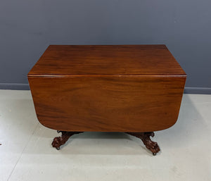 Circa 1845 Anthony Querville drop-leaf table in rich mahogany with carved pedestal base, acanthus detailing, and claw feet—classic American Empire antique furniture