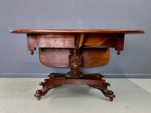 Circa 1845 Anthony Querville drop-leaf table in rich mahogany with carved pedestal base, acanthus detailing, and claw feet—classic American Empire antique furniture
