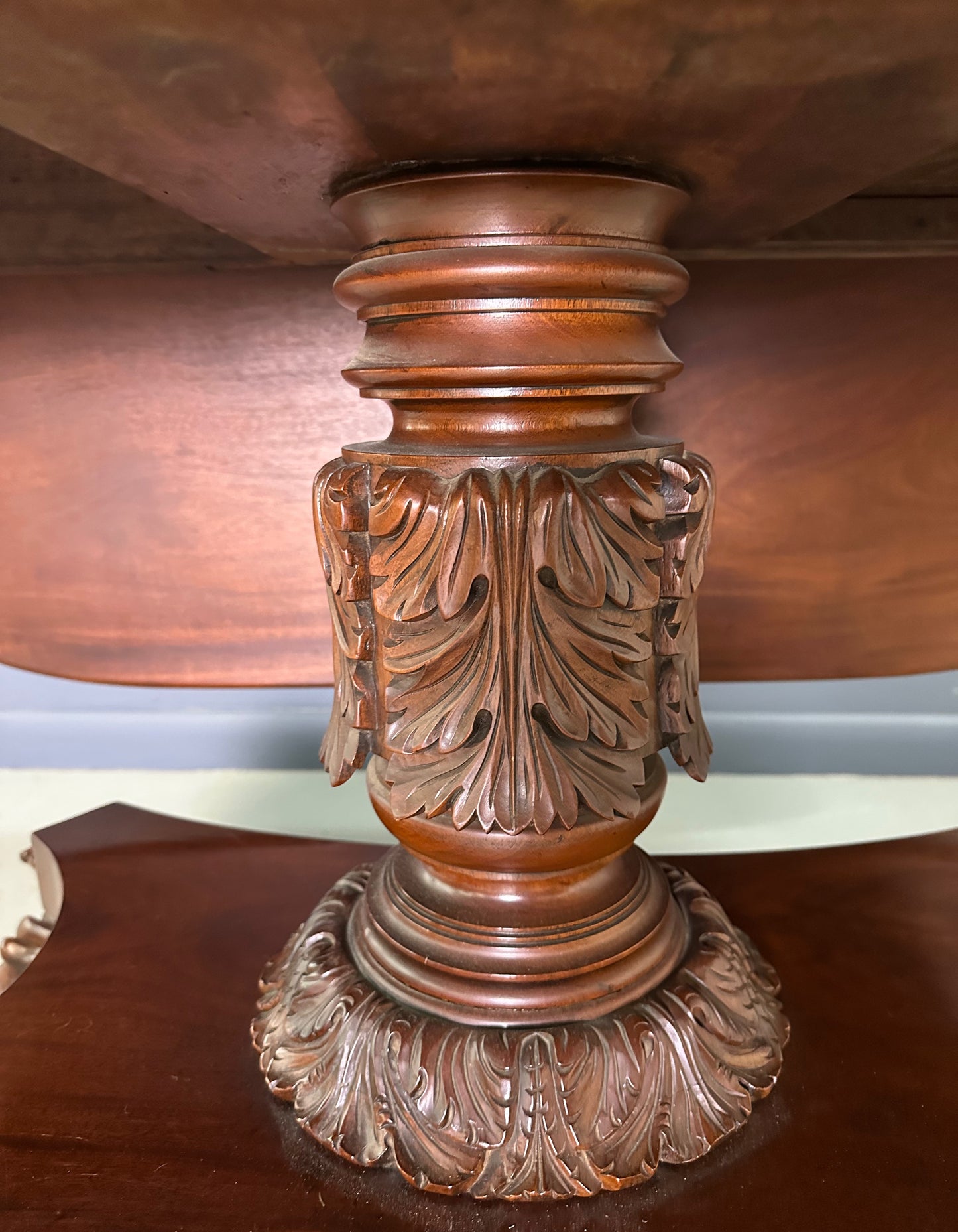 Circa 1845 Anthony Querville drop-leaf table in rich mahogany with carved pedestal base, acanthus detailing, and claw feet—classic American Empire antique furniture